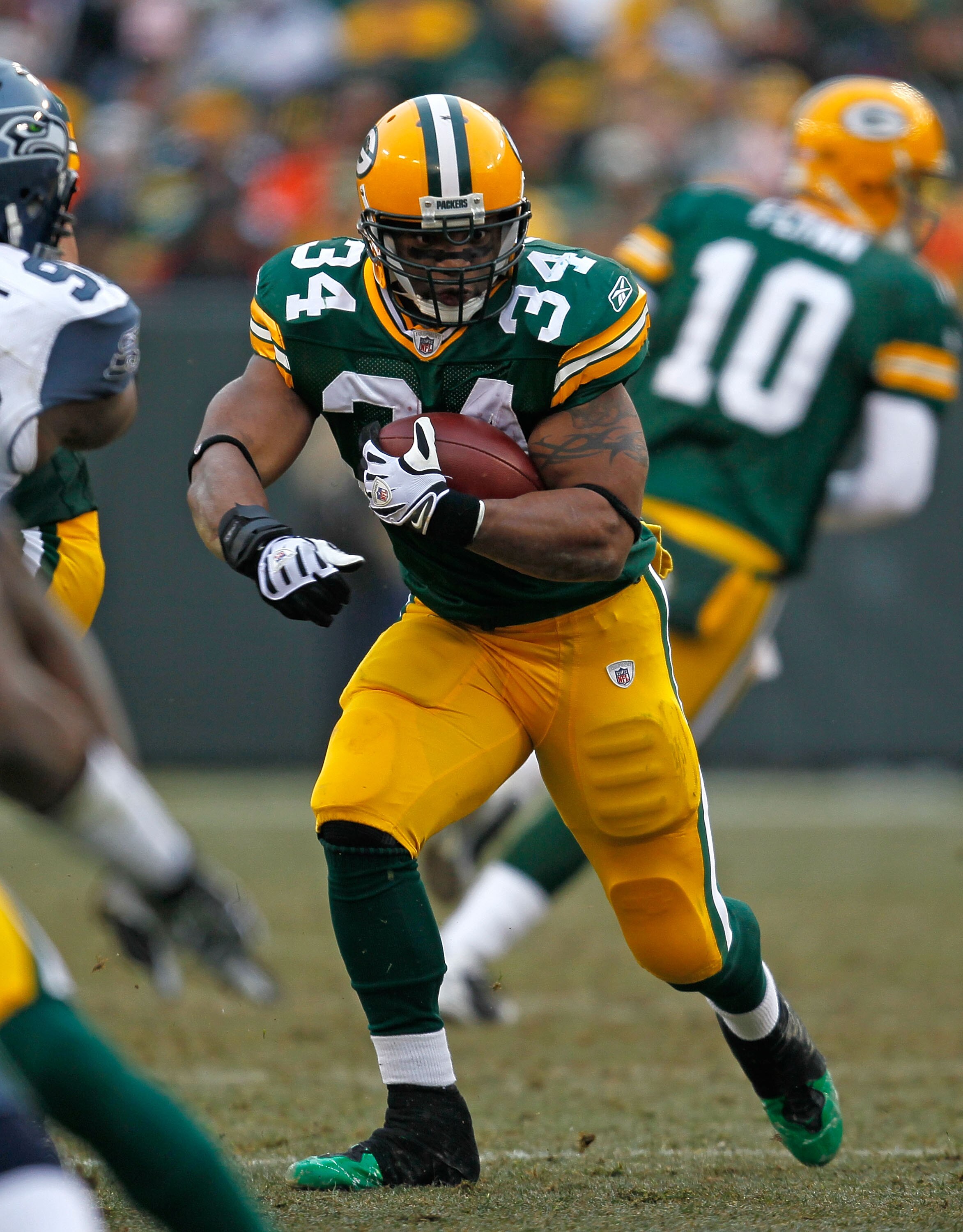 GREEN BAY, WI - DECEMBER 27: Ahman Green #34 of the Green Bay Packers runs for yardage against the Seattle Seahawks at Lambeau Field on December 27, 2009 in Green Bay, Wisconsin. The Packers defeated the Seahawks 48-10. (Photo by Jonathan Daniel/Getty Ima