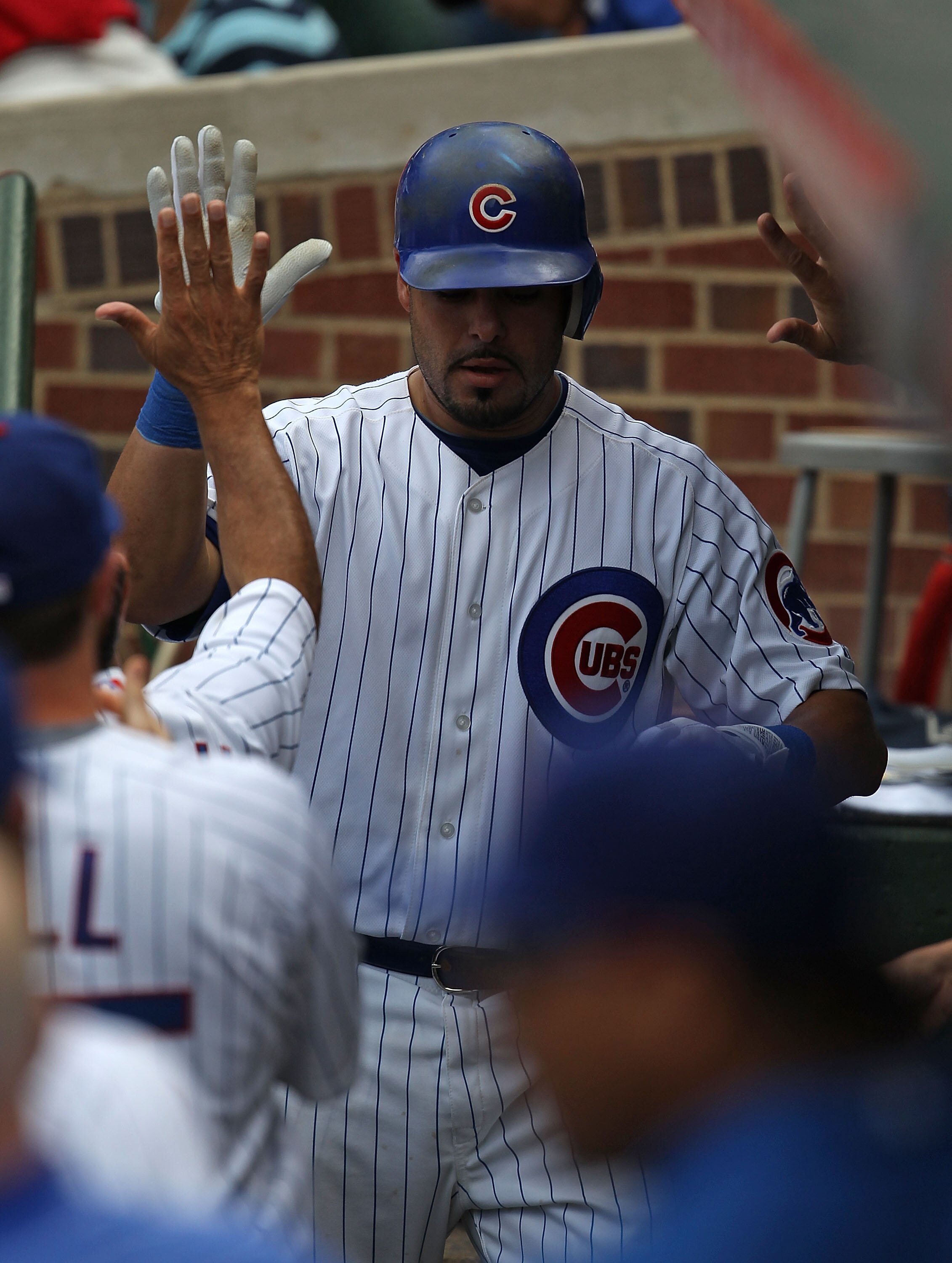 CHICAGO - SEPTEMBER 05: Geovany Soto #18 of the Chicago Cubs is greeted by teammates in the dugout after hitting a home run against the New York Mets at Wrigley Field on September 5, 2010 in Chicago, Illinois. The Mets defeated the Cubs 18-5. (Photo by Jo CHICAGO - SEPTEMBER 05: Geovany Soto #18 of the Chicago Cubs is greeted by teammates in the dugout after hitting a home run against the New York Mets at Wrigley Field on September 5, 2010 in Chicago, Illinois. The Mets defeated the Cubs 18-5. (Photo by Jo