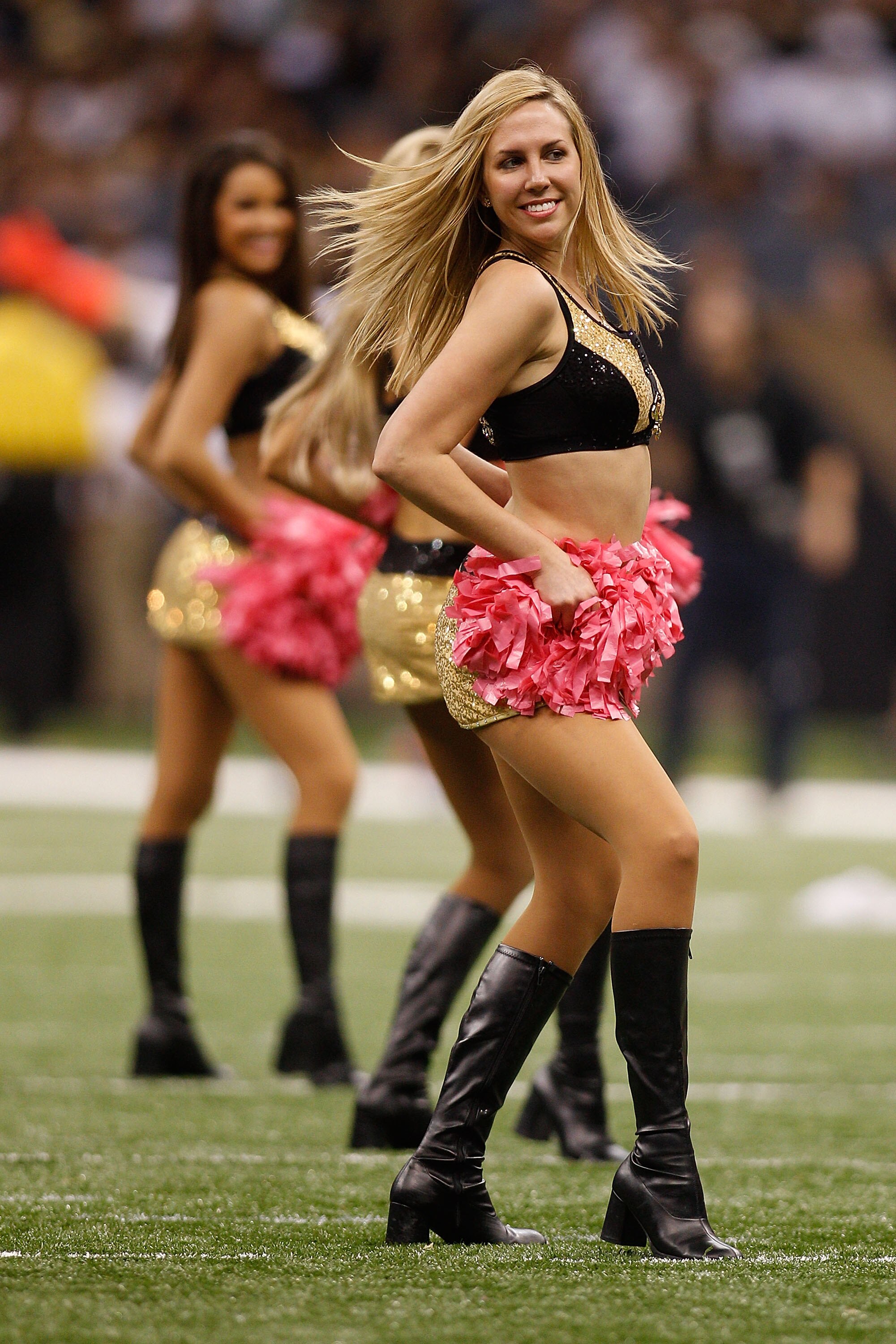 NEW ORLEANS - OCTOBER 24:  Members of the Saintsations cheerleaders of the New Orleans Saints perform during the game against the Cleveland Browns at the Louisiana Superdome on October 24, 2010 in New Orleans, Louisiana.  (Photo by Chris Graythen/Getty Im