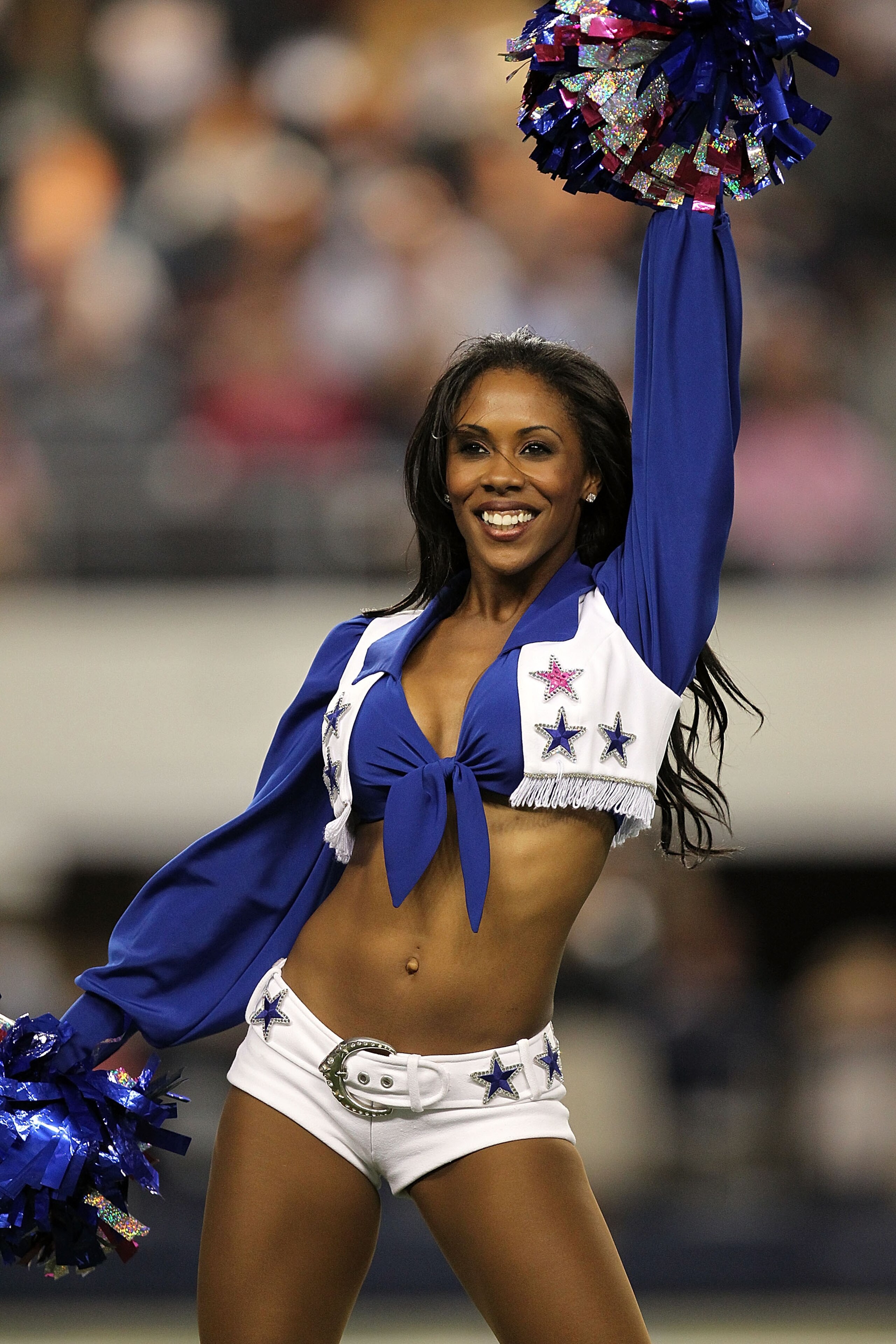 ARLINGTON, TX - OCTOBER 10: A Dallas Cowboys cheerleader performs at Cowboys Stadium on October 10, 2010 in Arlington, Texas. (Photo by Ronald Martinez/Getty Images) ARLINGTON, TX - OCTOBER 10: A Dallas Cowboys cheerleader performs at Cowboys Stadium on October 10, 2010 in Arlington, Texas. (Photo by Ronald Martinez/Getty Images)