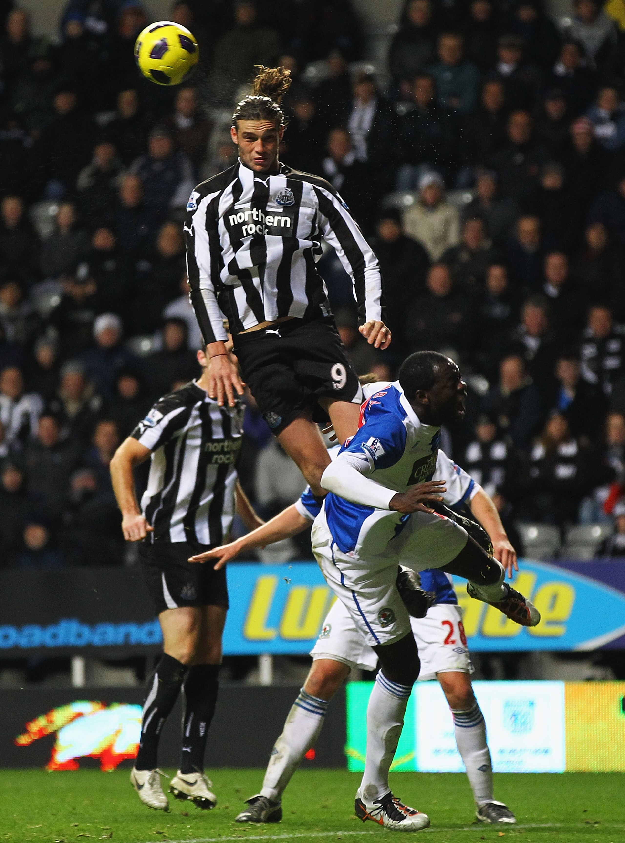 NEWCASTLE UPON TYNE, ENGLAND - NOVEMBER 10:  Andy Carroll of Newcastle wins the ball ahead of Christopher Samba of Blackburn during the Barclays Premier League match between Newcastle United and Blackburn Rovers at St James' Park on November 10, 2010 in N