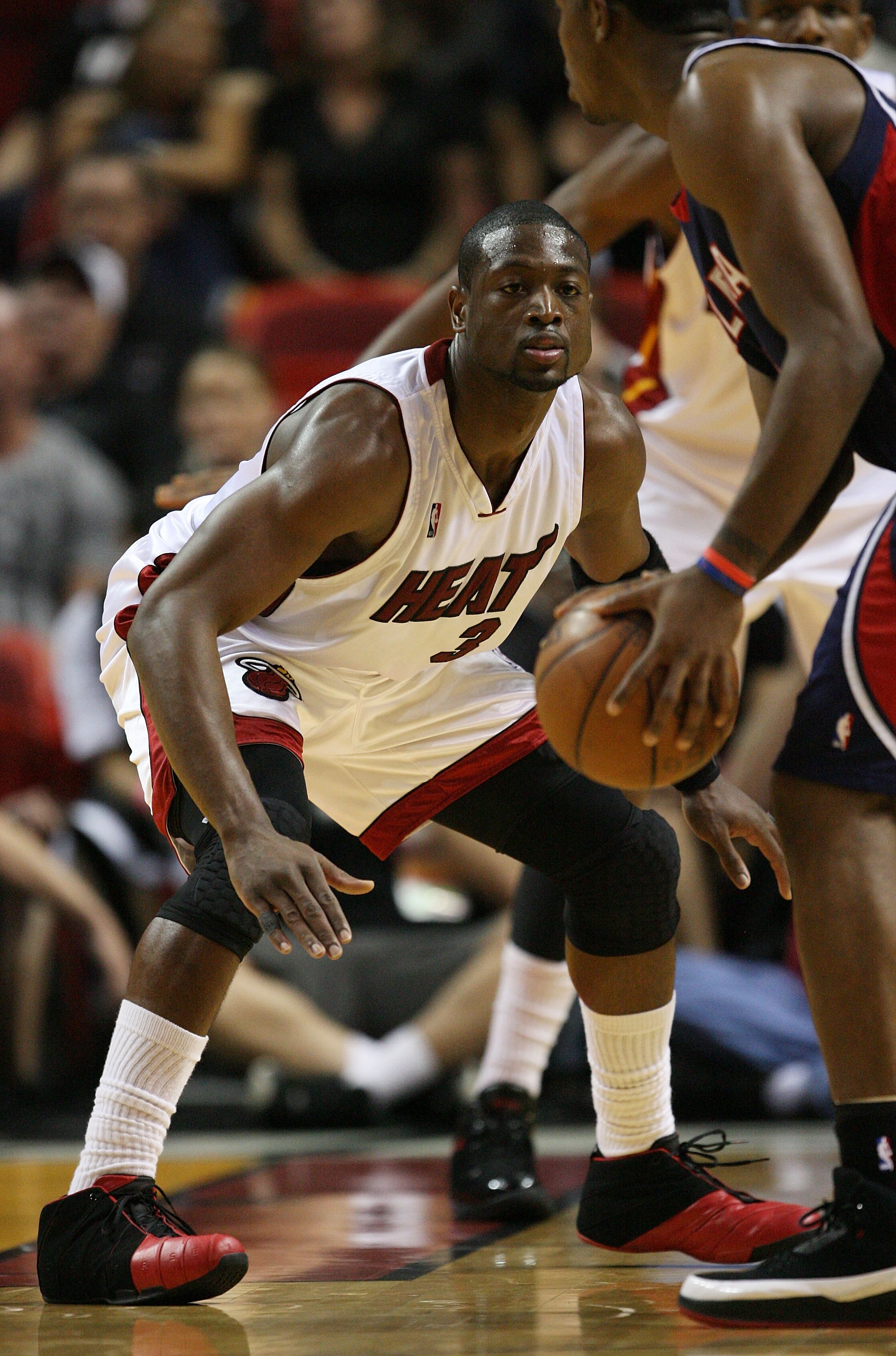 MIAMI - MAY 01:  Dwyane Wade #3 of the Miami Heat plays tight defense on Joe Johnson #2 of the Atlanta Hawks during Game Six of the Eastern Conference Quarterfinals at American Airlines Arena on May 1, 2009 in Miami, Florida. NOTE TO USER: User expressly