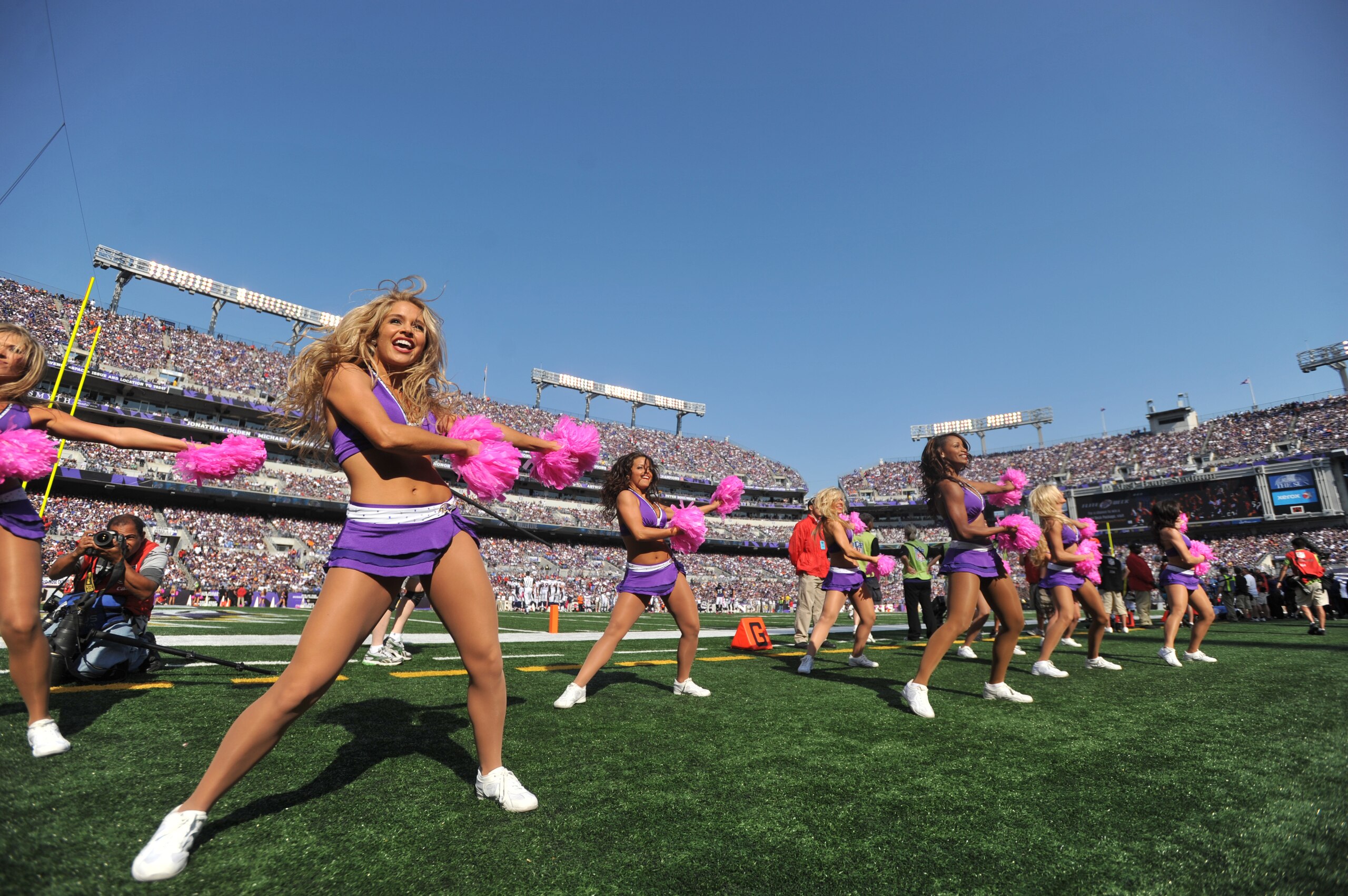 BALTIMORE, MD - OCTOBER 10: Cheerleaders for the Baltimore Ravens cheer during the game against the Denver Broncos at M&T Bank Stadium on October 10, 2010 in Baltimore, Maryland. Players wore pink in recognition of Breast Cancer Awareness Month. The Raven BALTIMORE, MD - OCTOBER 10: Cheerleaders for the Baltimore Ravens cheer during the game against the Denver Broncos at M&T Bank Stadium on October 10, 2010 in Baltimore, Maryland. Players wore pink in recognition of Breast Cancer Awareness Month. The Raven