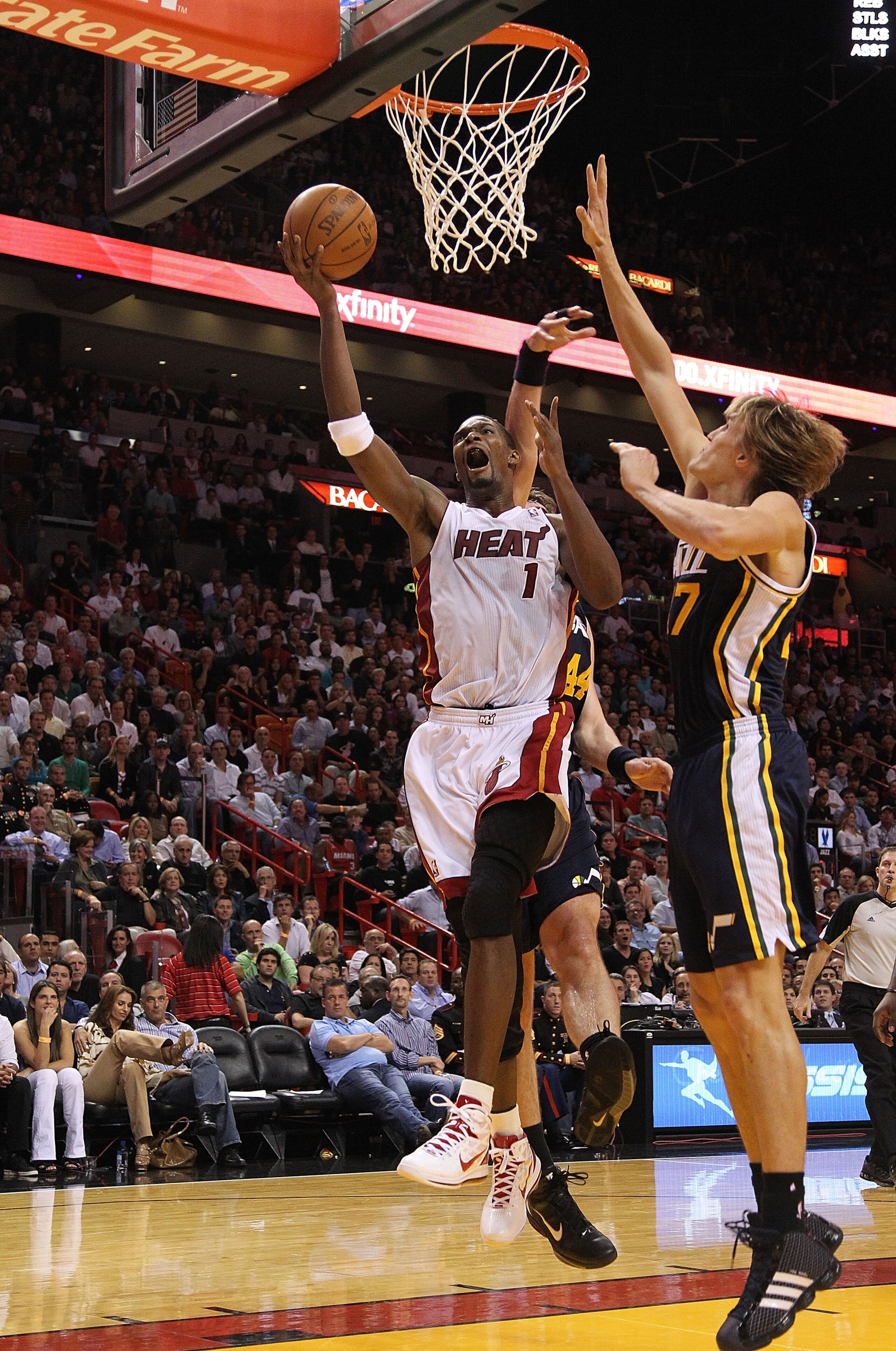 MIAMI - NOVEMBER 09:  Chris Bosh #1 of the Miami Heat drives to the hoop during a game against the Utah Jazz at American Airlines Arena on November 9, 2010 in Miami, Florida. NOTE TO USER: User expressly acknowledges and agrees that, by downloading and/or