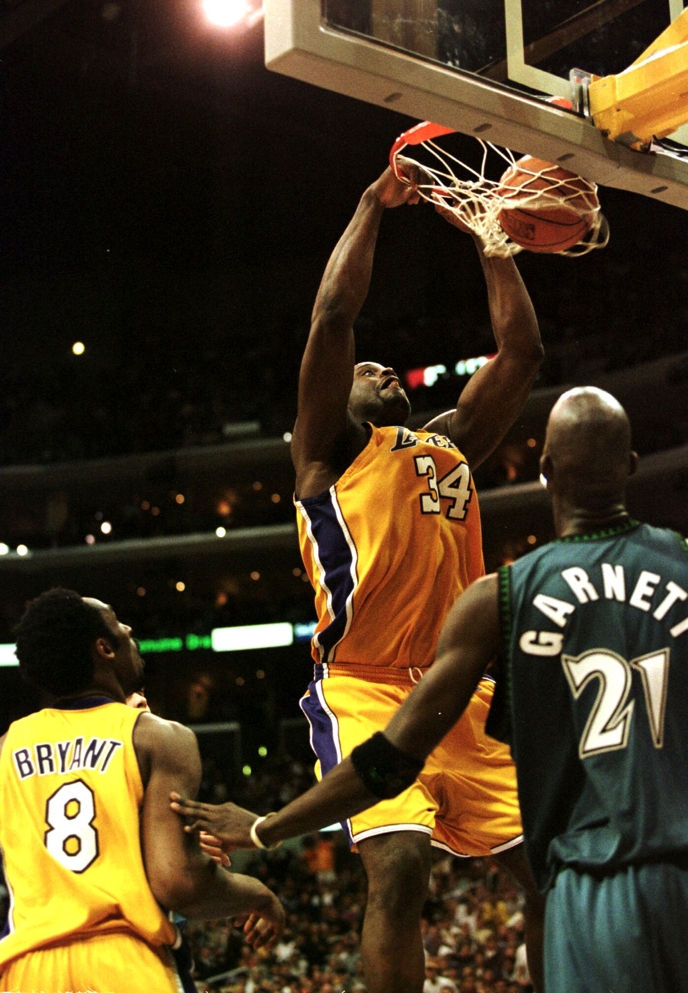 16 Apr 2000: Shaquille O''Neal #34 of the Los Angeles Lakers slam dunks the ball as teammate Kobe Bryant #8 and Kevin Garnett #21 of the Minnesota Timberwolves look on during their game at the Staples Center in Los Angeles, California. The Lakers defeated