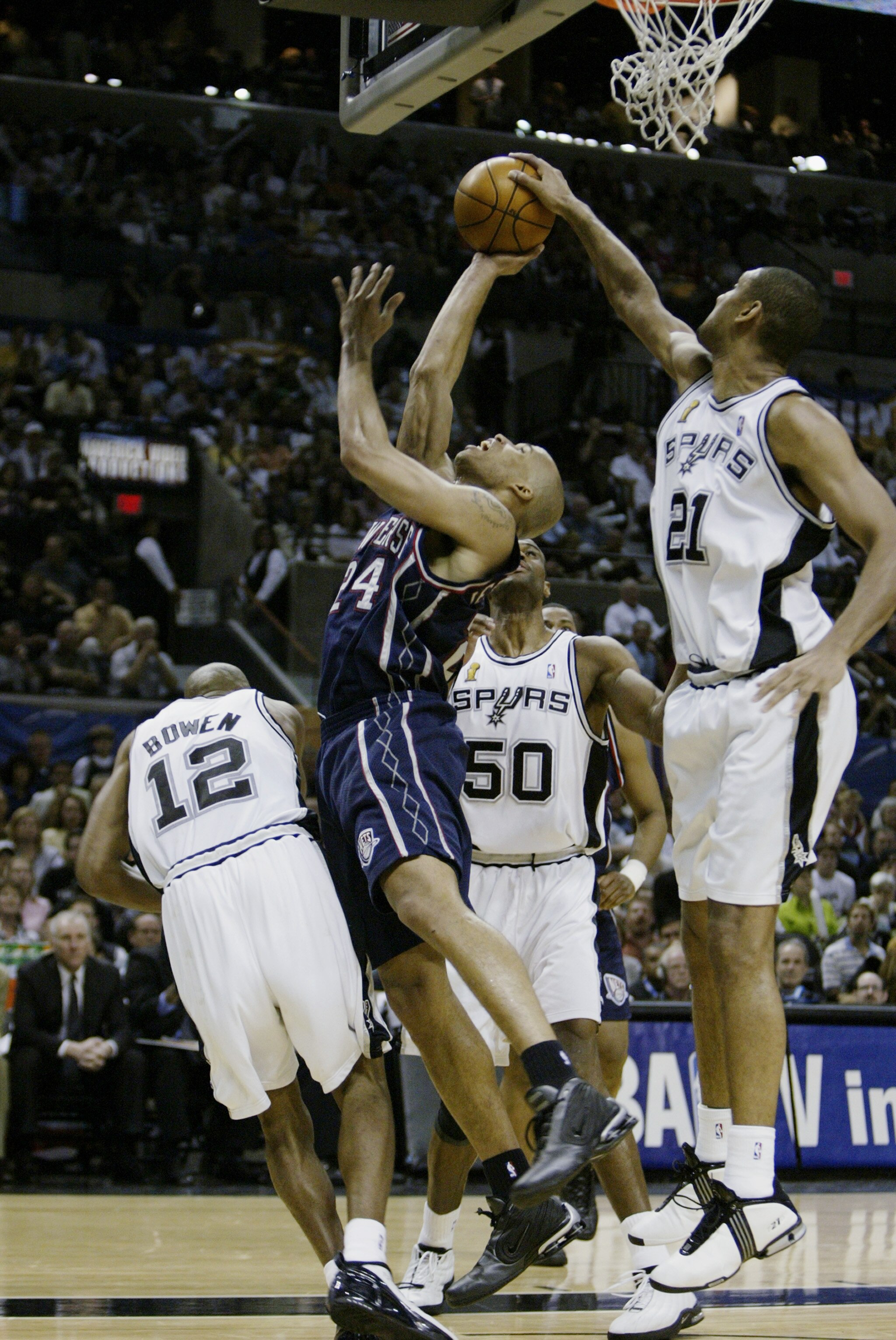 SAN ANTONIO, TX - JUNE 15:  Tim Duncan #21 of the San Antonio Spurs gets a hand on a shot by Richard Jefferson #24 of the New Jersey Nets during game six of the 2003 NBA Finals on June 15, 2003 at the SBC Center in San Antonio, Texas.  The Spurs won 88-77
