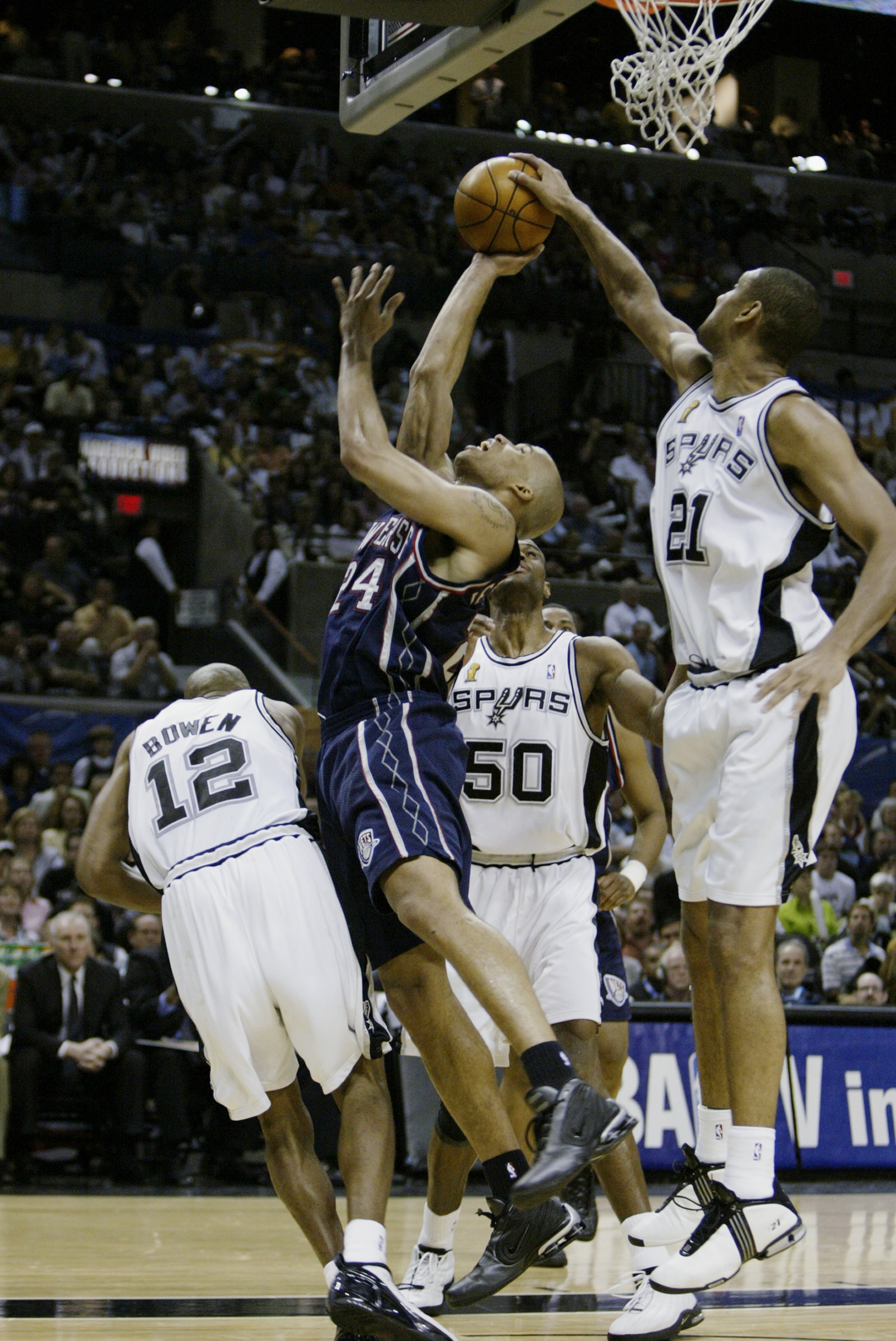 SAN ANTONIO, TX - JUNE 15:  Tim Duncan #21 of the San Antonio Spurs gets a hand on a shot by Richard Jefferson #24 of the New Jersey Nets during game six of the 2003 NBA Finals on June 15, 2003 at the SBC Center in San Antonio, Texas.  The Spurs won 88-77