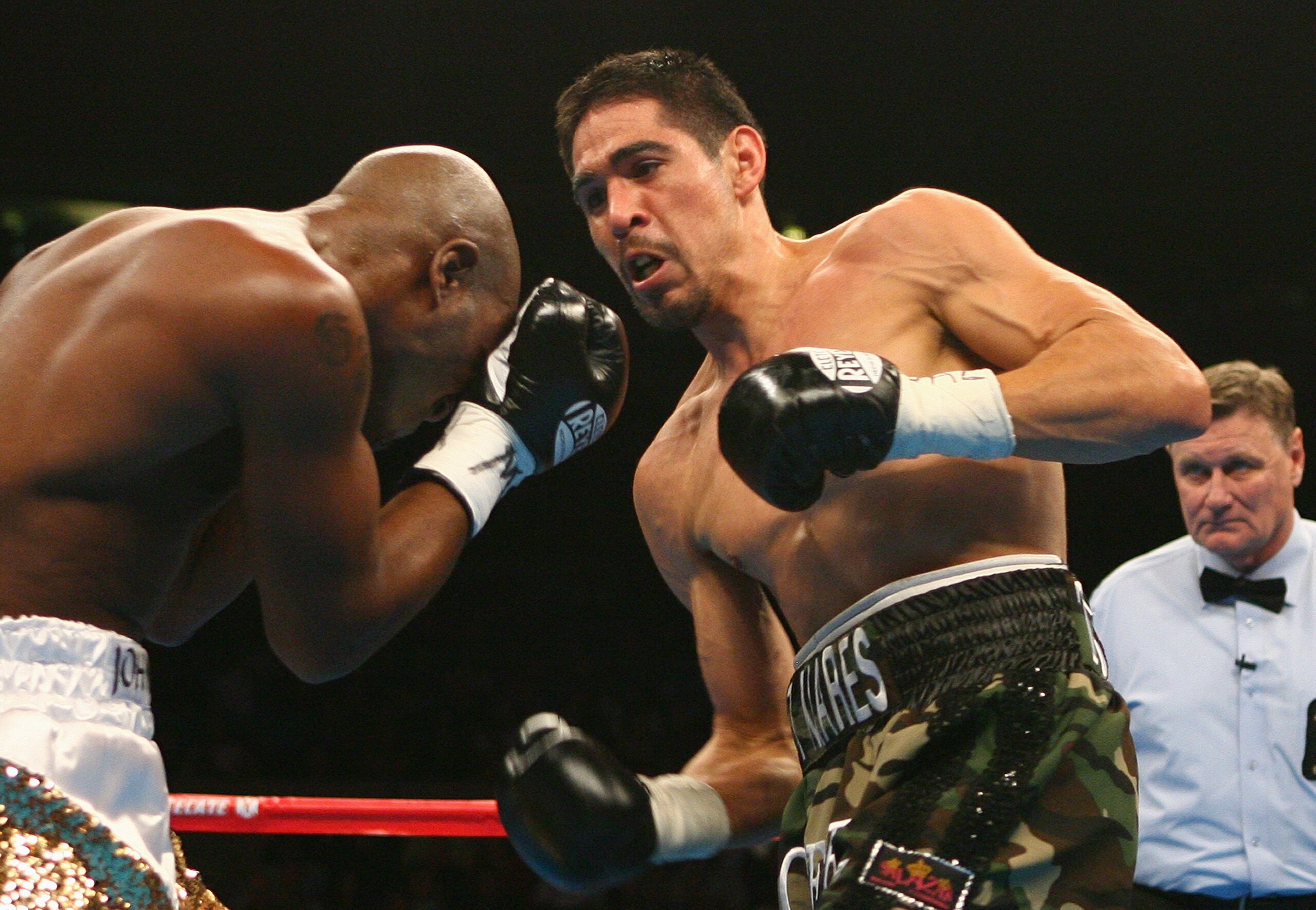 NEW YORK - NOVEMBER 10:  Antonio Margarito and Golden Johnson exchange punches during their WBO Intercontinental Welterweight title fight at Madison Square Garden on November 10, 2007 in New York City, New York. (Photo by Al Bello/Getty Images)