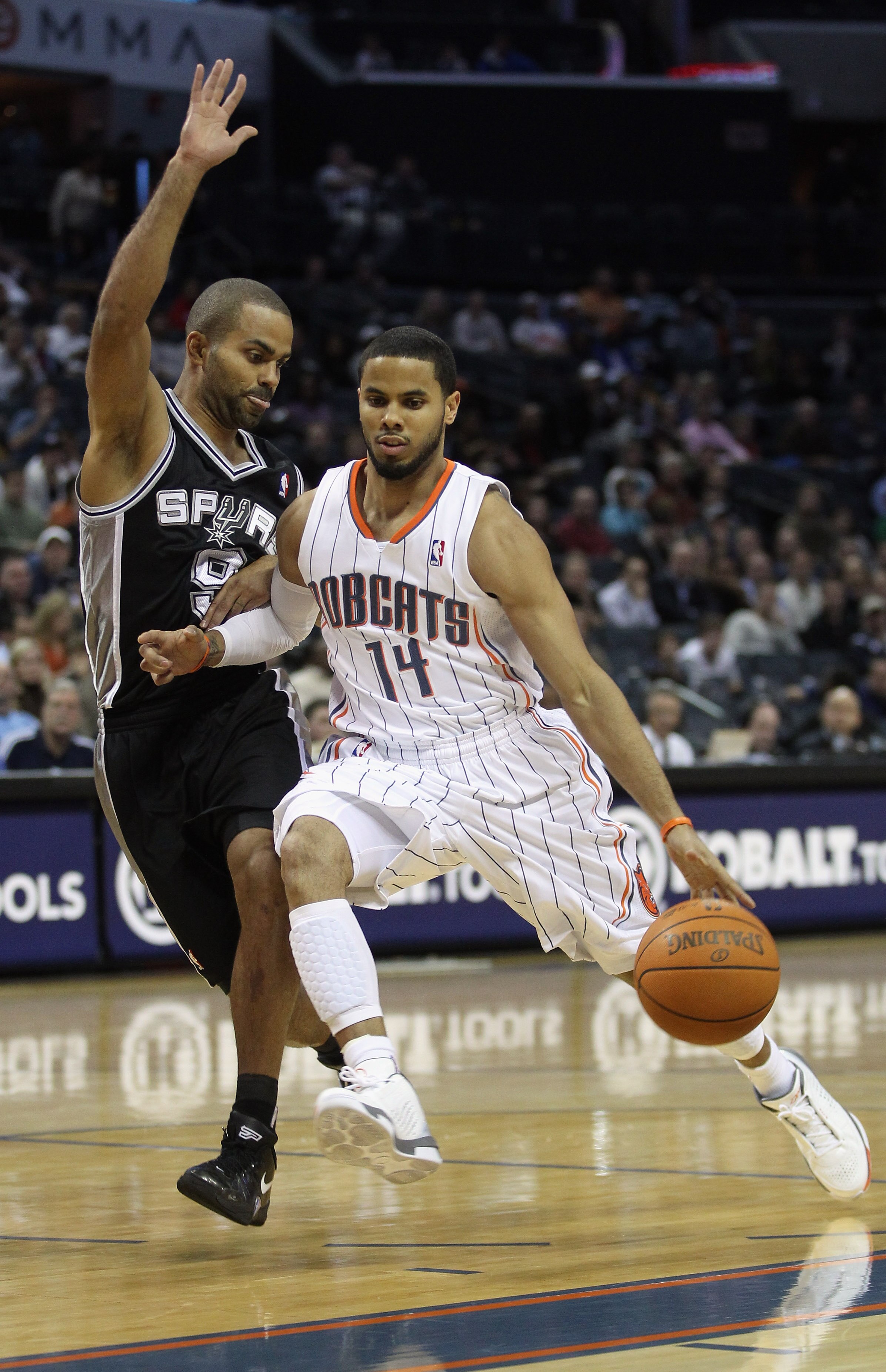 CHARLOTTE, NC - NOVEMBER 08:  Tony Parker #9 of the San Antonio Spurs tries to stop D.J. Augustin #14 of the Charlotte Bobcats during their game at Time Warner Cable Arena on November 8, 2010 in Charlotte, North Carolina.  NOTE TO USER: User expressly ack