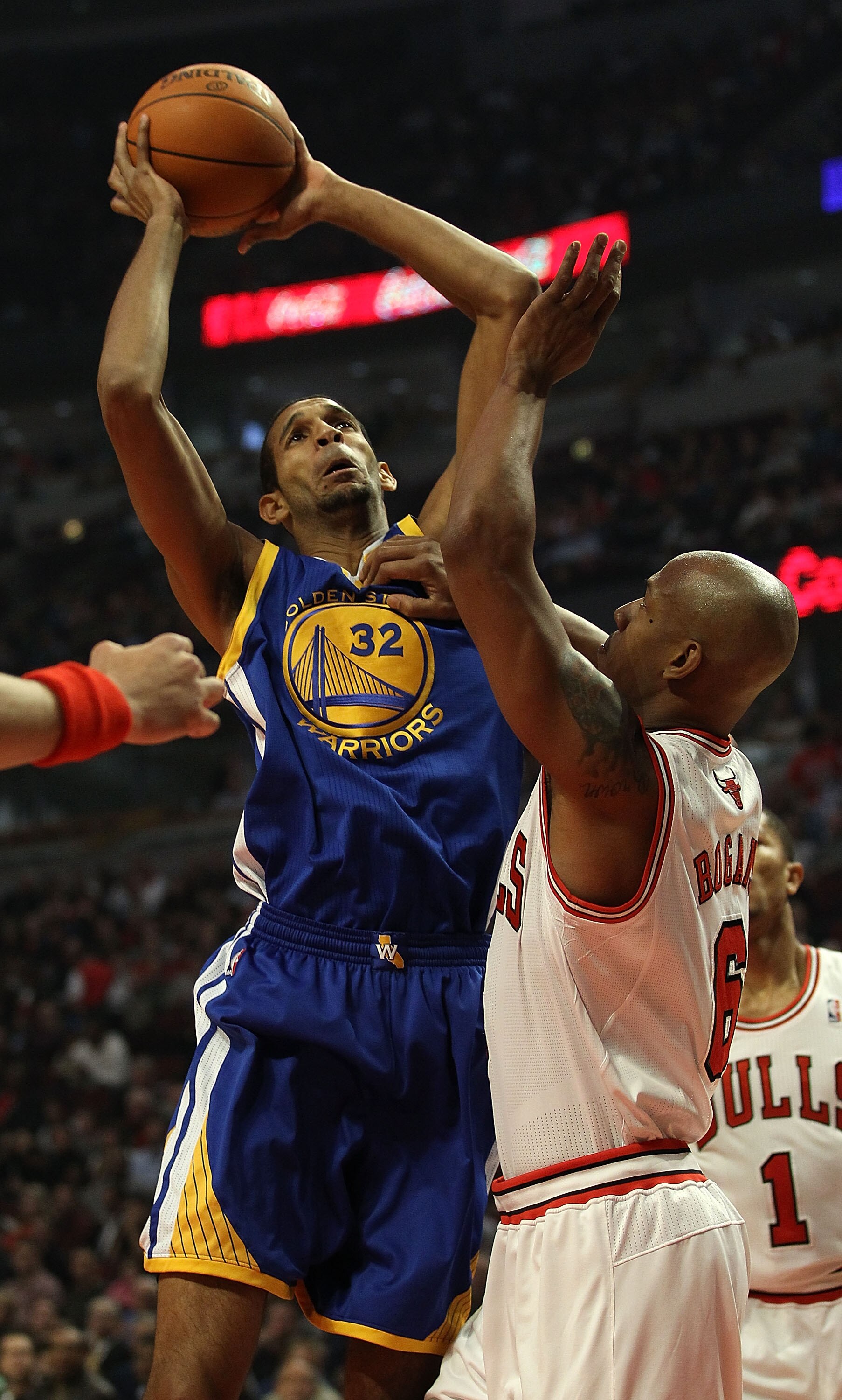 CHICAGO - NOVEMBER 11: Brandon Wright #32 of the Golden State Warriors puts up a shot against Keith Bogans #6 of the Chicago Bulls at the United Center on November 11, 2010 in Chicago, Illinois. NOTE TO USER: User expressly acknowledges and agrees that, b