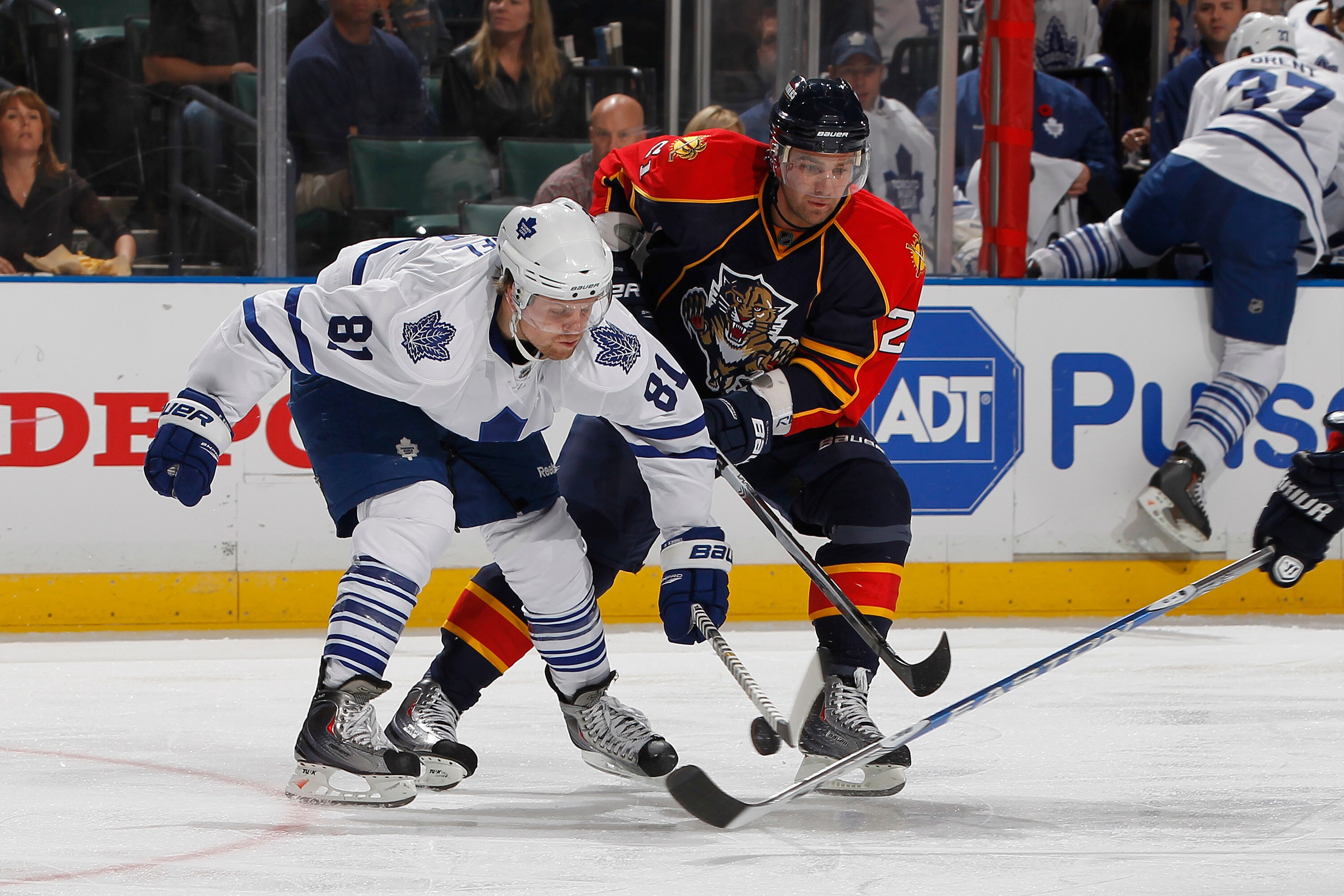 SUNRISE, FL - NOVEMBER 10: Christopher Higgins #21 of the Florida Panthers and Phil Kessel #81 of the Toronto Maple Leafs fight for control of the puck on November 10, 2010 at the BankAtlantic Center in Sunrise, Florida. The Panthers defeated the Maple Le