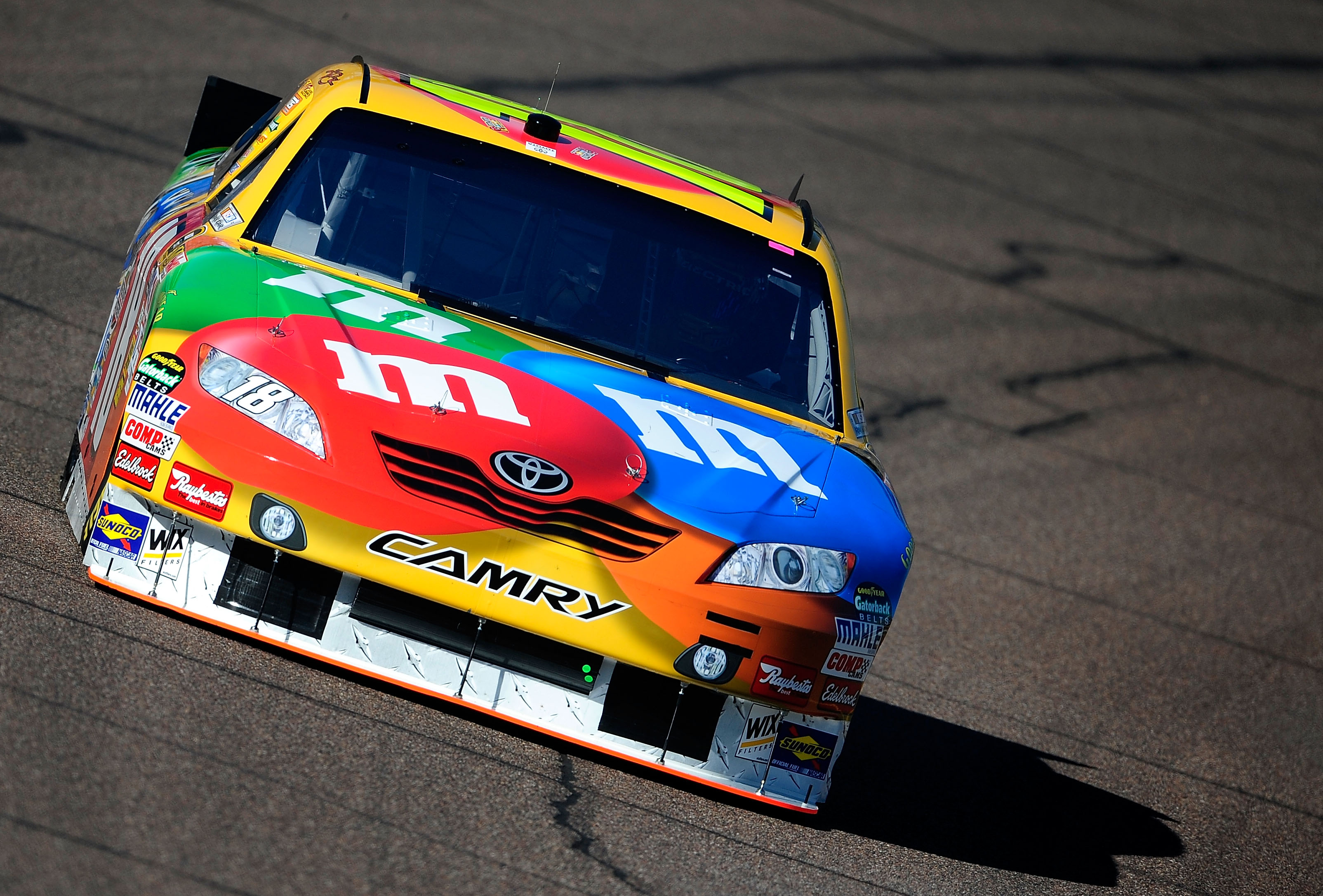 AVONDALE, AZ - NOVEMBER 12:  Kyle Busch, driver of the #18 M&M'sToyota, practices for the NASCAR Sprint Cup Series Kobalt Tools 500 at Phoenix International Raceway on November 12, 2010 in Avondale, Arizona.  (Photo by Rusty Jarrett/Getty Images for NASCA