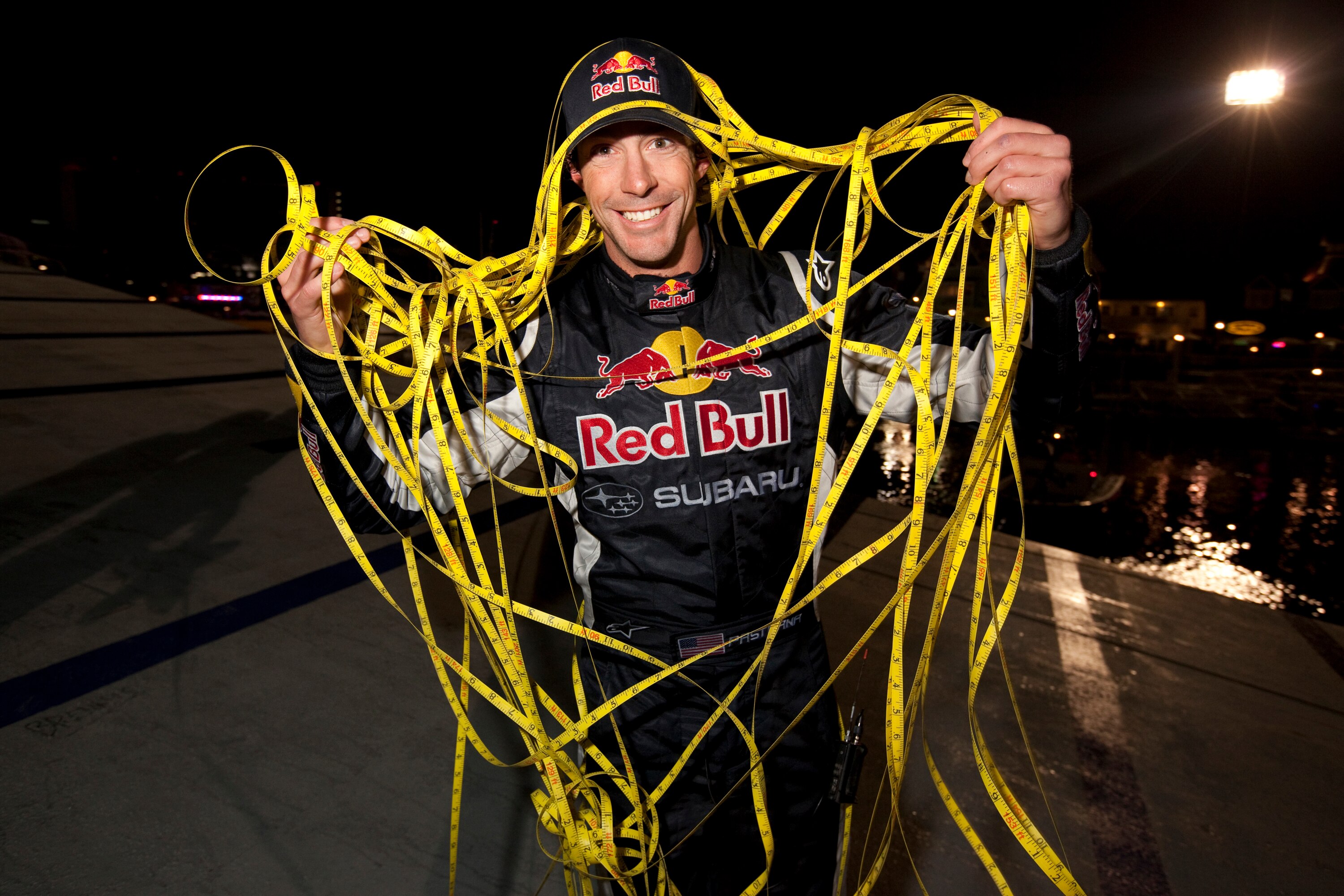 LONG BEACH, CA - DECEMBER 31: In this handout image provided by Red Bull Photofiles, Travis Pastrana poses after breaking the world record for the longest distance jump in a rally car on December 31, 2009 in Long Beach, California. The ramp to ramp jump w