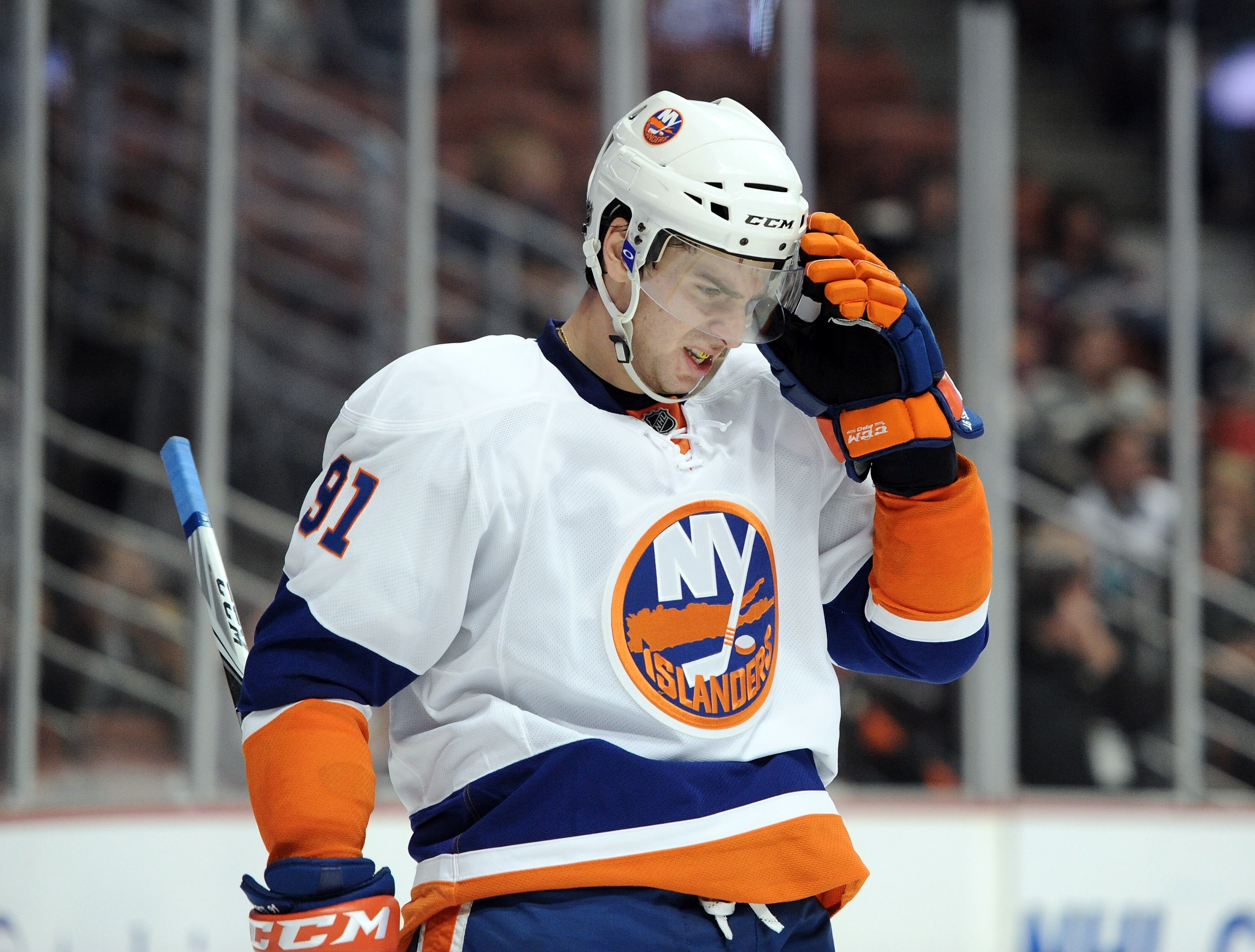 ANAHEIM, CA - NOVEMBER 10:  John Tavares #91 of the New York Islanders adjusts his visor against the Anaheim Ducks at the Honda Center on November 10, 2010 in Anaheim, California.  (Photo by Harry How/Getty Images)