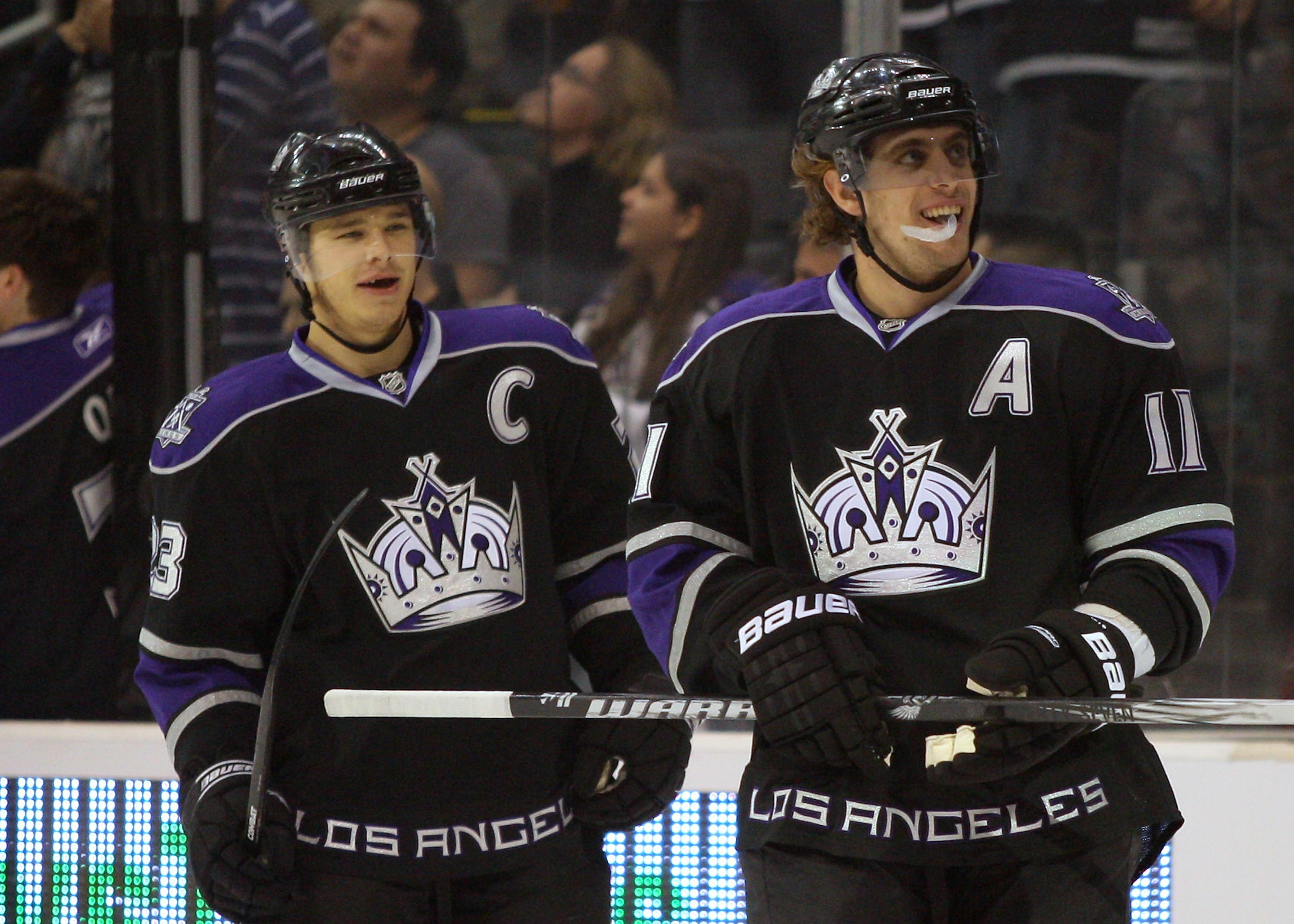 LOS ANGELES, CA - NOVEMBER 06:  Dustin Brown #23 and Anze Kopitar #11 of the Los Angeles Kings look on after celebrating Kopitar's first-period goal against the Nashville Predators during the NHL game at Staples Center on November 6, 2010 in Los Angeles,