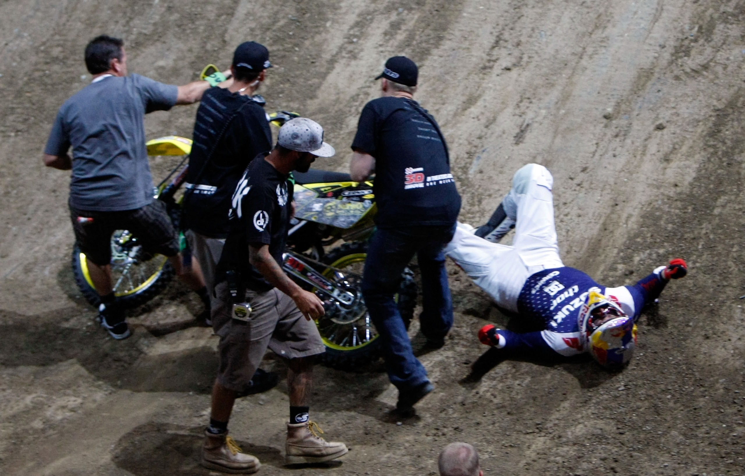 LOS ANGELES, CA - JULY 31:  Travis Pastrana is attended to after crashing while competing in the Moto X Best Trick Final during X Games 15 at Staples Center on July 31, 2009 in Los Angeles, California.  (Photo by Jeff Gross/Getty Images)