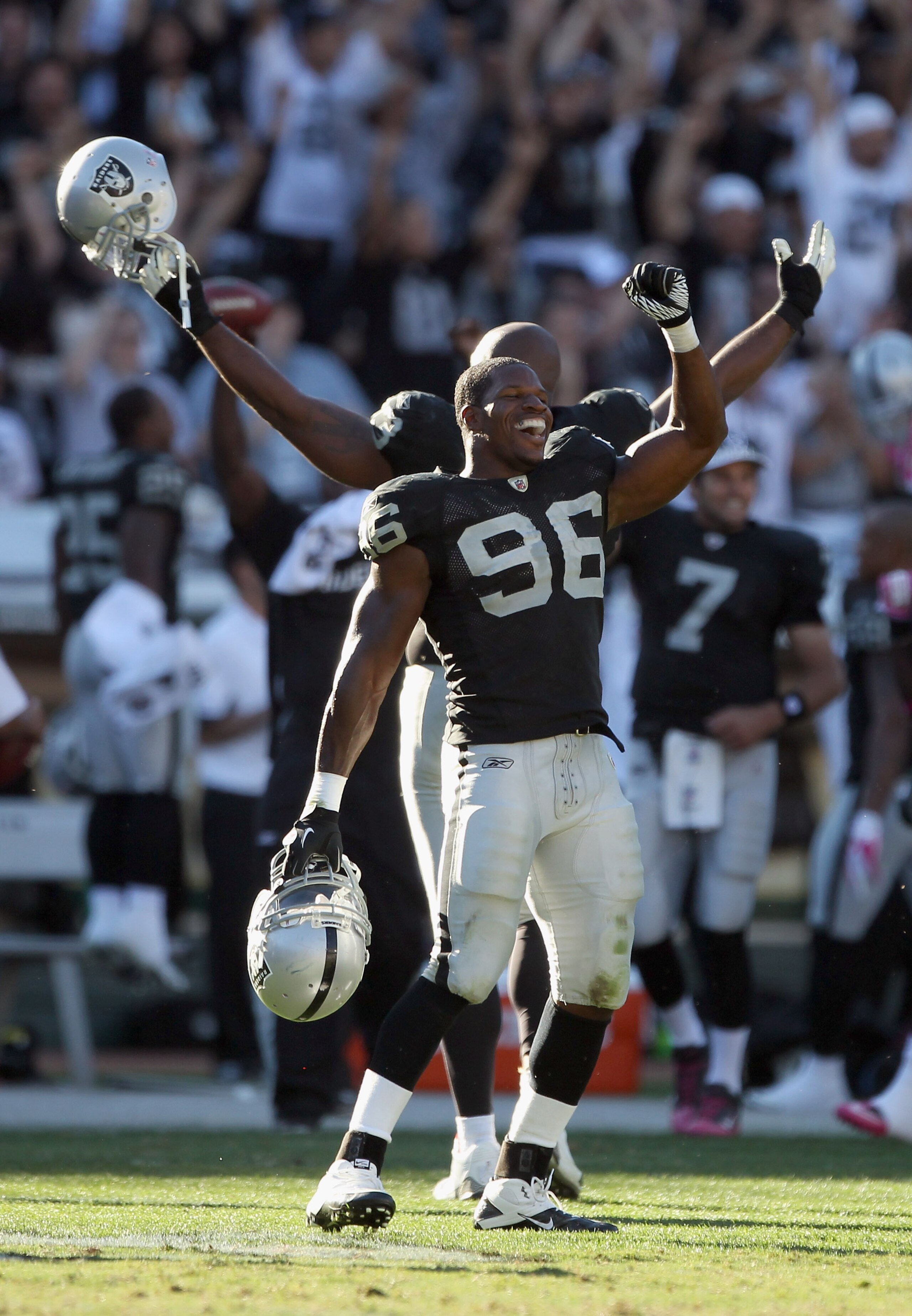 OAKLAND, CA - OCTOBER 10:  Kamerion Wimbley #96 and the rest of the Oakland Raiders celebrate after a replay review ruled that the Tyvon Branch fumble return was a touchdown in the fourth quarter of their game against the San Diego Chargers at Oakland-Ala