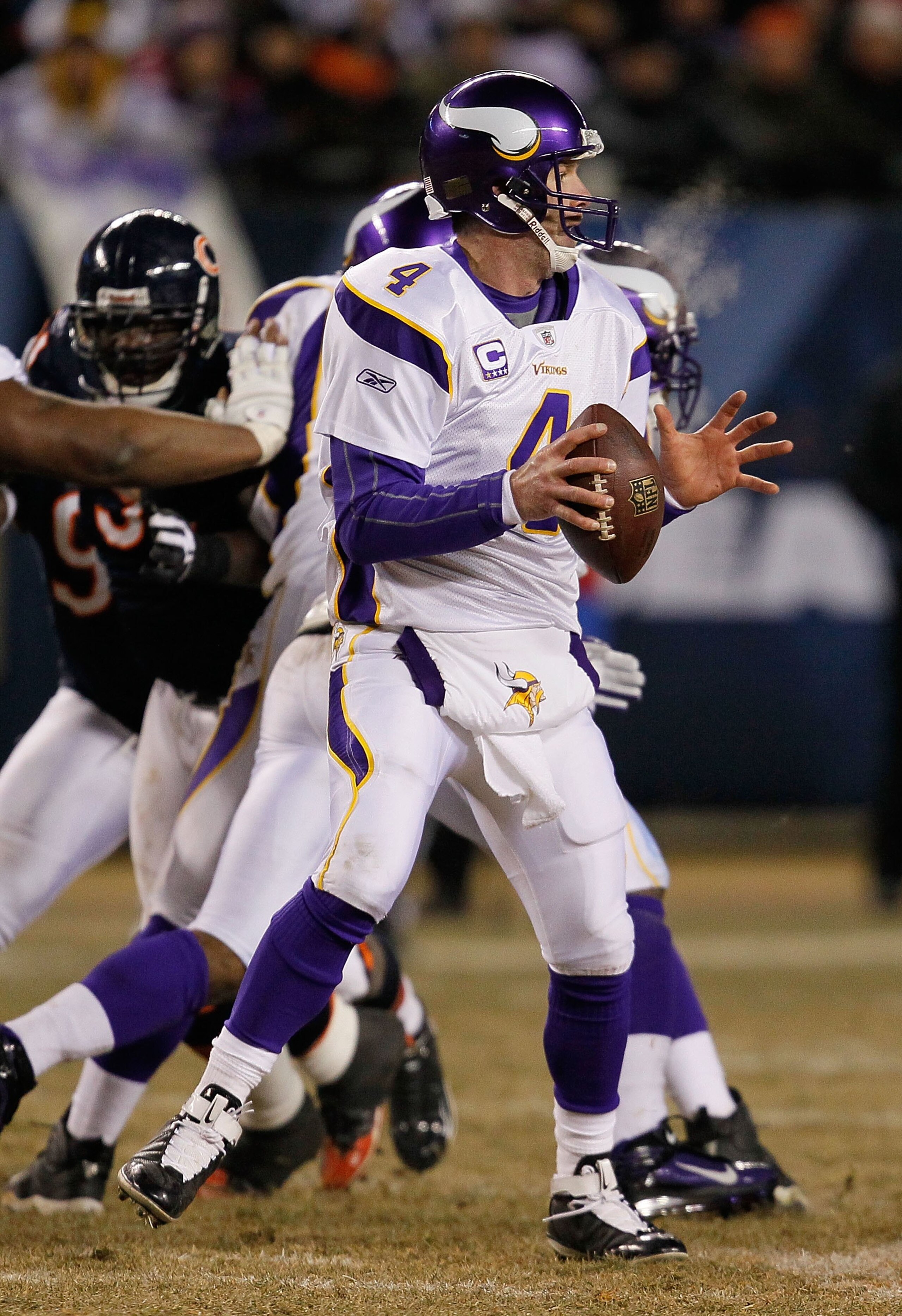 CHICAGO - DECEMBER 28: Brett Favre #4 of the Minnesota Vikings looks for a receiver against the Chicago Bears at Soldier Field on December 28, 2009 in Chicago, Illinois. The Bears defeated the Vikings 36-30 in overtime. (Photo by Jonathan Daniel/Getty Ima