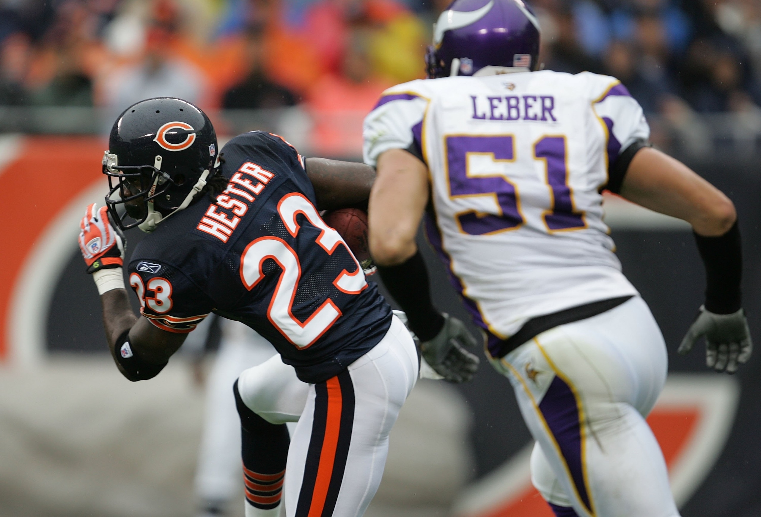 CHICAGO - OCTOBER 14: Devin Hester #23 of the Chicago Bears runs past Ben Leber #51 of the Minnesota Vikings while returning a punt for a touchdown on October 14, 2007 at Soldier Field in Chicago, Illinois. The Vikings defeated the Bears 34-31. (Photo by