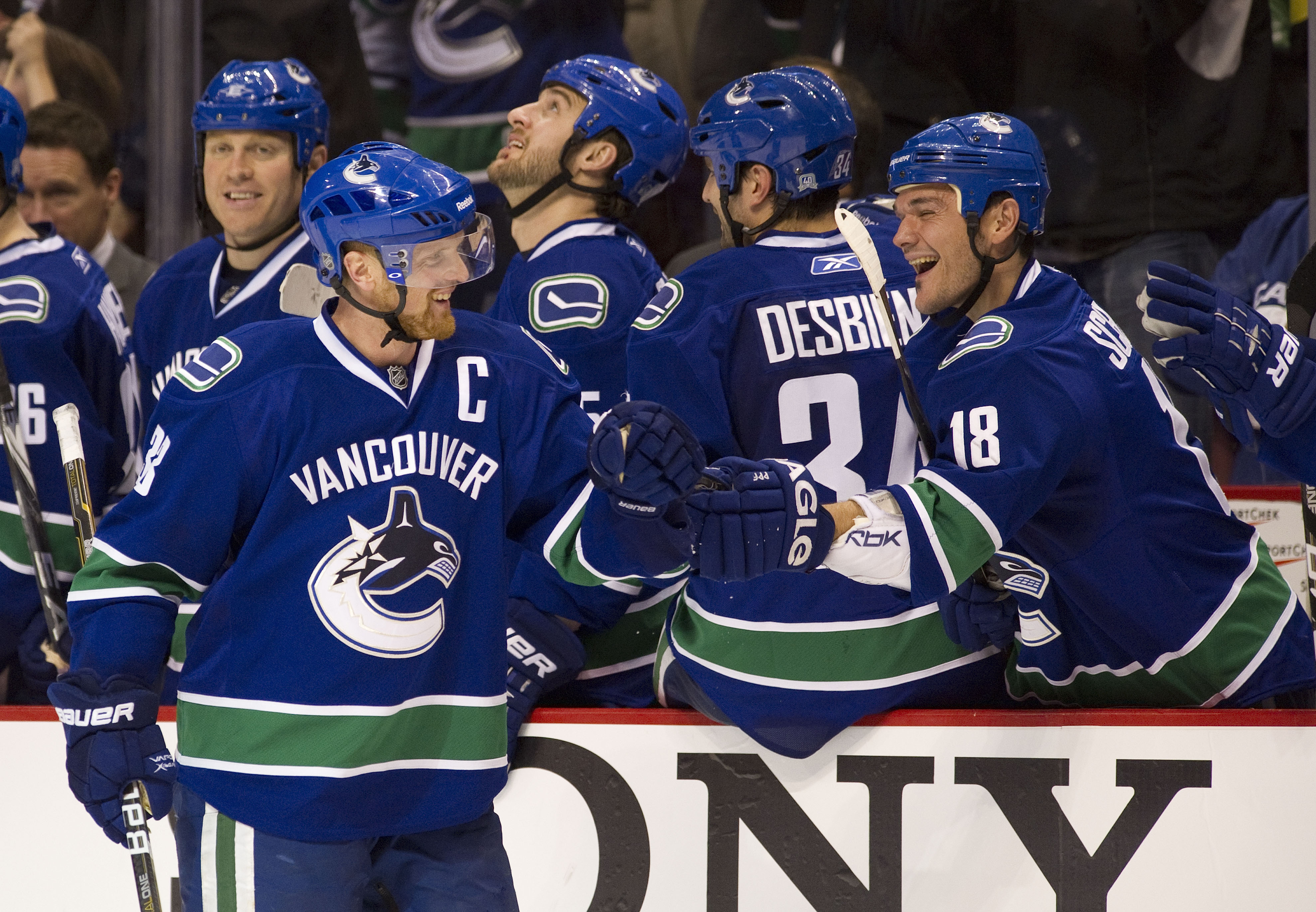 VANCOUVER, CANADA - NOVEMBER 01: Henrik Sedin #33 of the Vancouver Canucks is congratulated by teammate Peter Schaefer #18 after scoring on a penalty shot against the New Jersey Devils during the third period in NHL action on November 01, 2010 at Rogers A