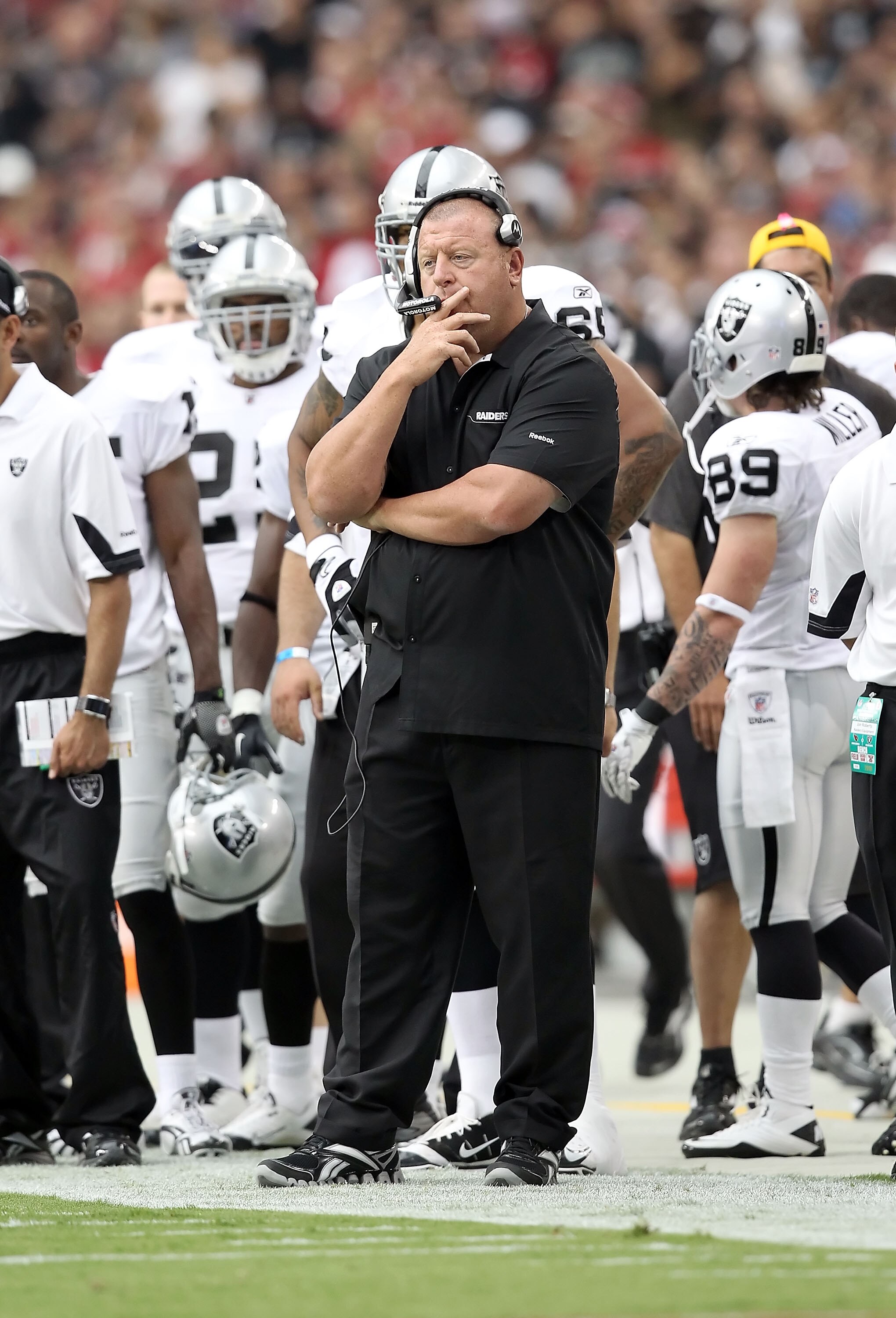 GLENDALE, AZ - SEPTEMBER 26:  Head coach Tom Cable of the Oakland Raiders stands on the sidelines during the NFL game against the Arizona Cardinals at the University of Phoenix Stadium on September 26, 2010 in Glendale, Arizona.  The Cardinals defeated th