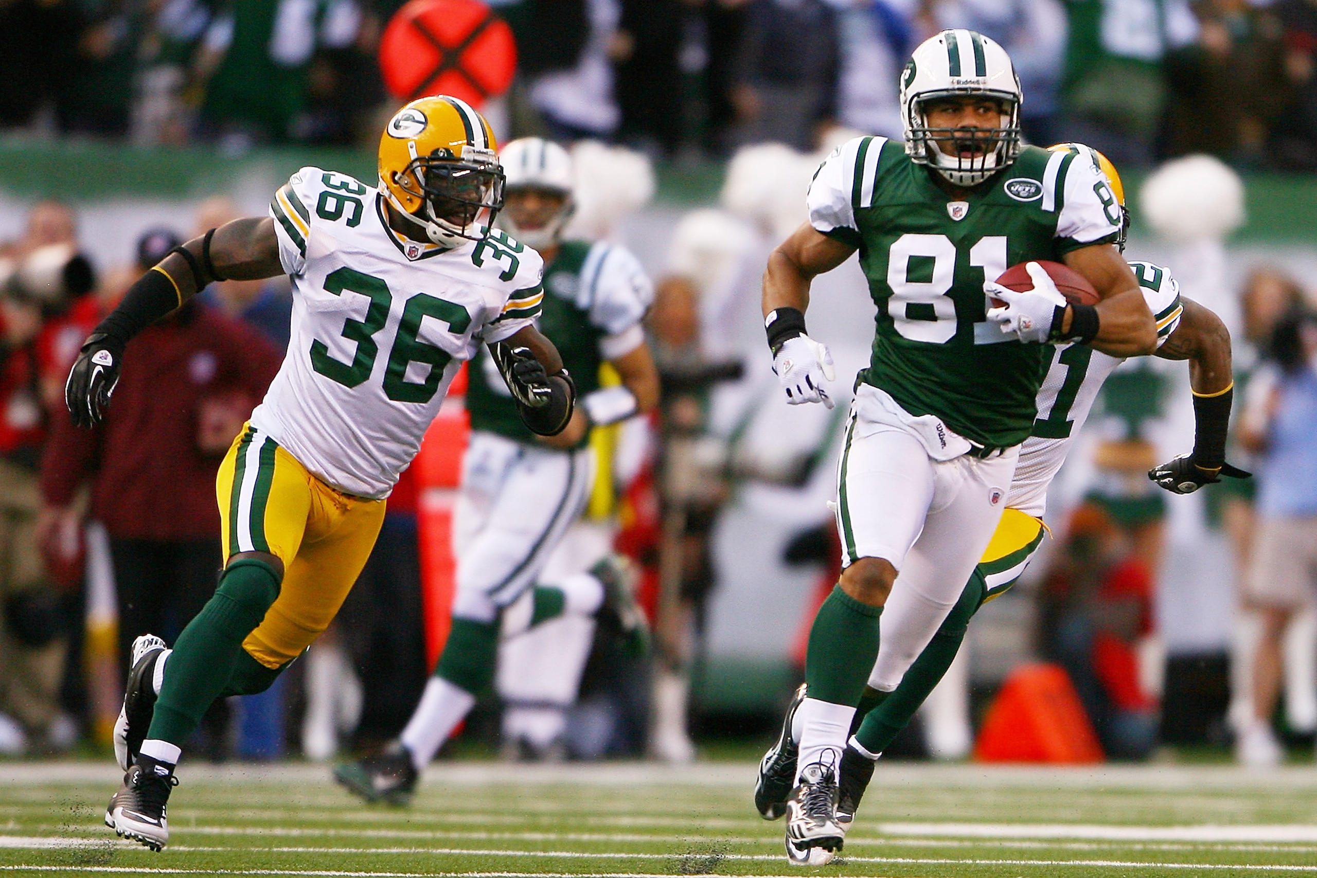 EAST RUTHERFORD, NJ - OCTOBER 31:  Dustin Keller #81 of the New York Jets runs with the ball while Nick Collins #36 of the Green Bay Packers chases him on October 31, 2010 at the New Meadowlands Stadium in East Rutherford, New Jersey. The Packers defeated