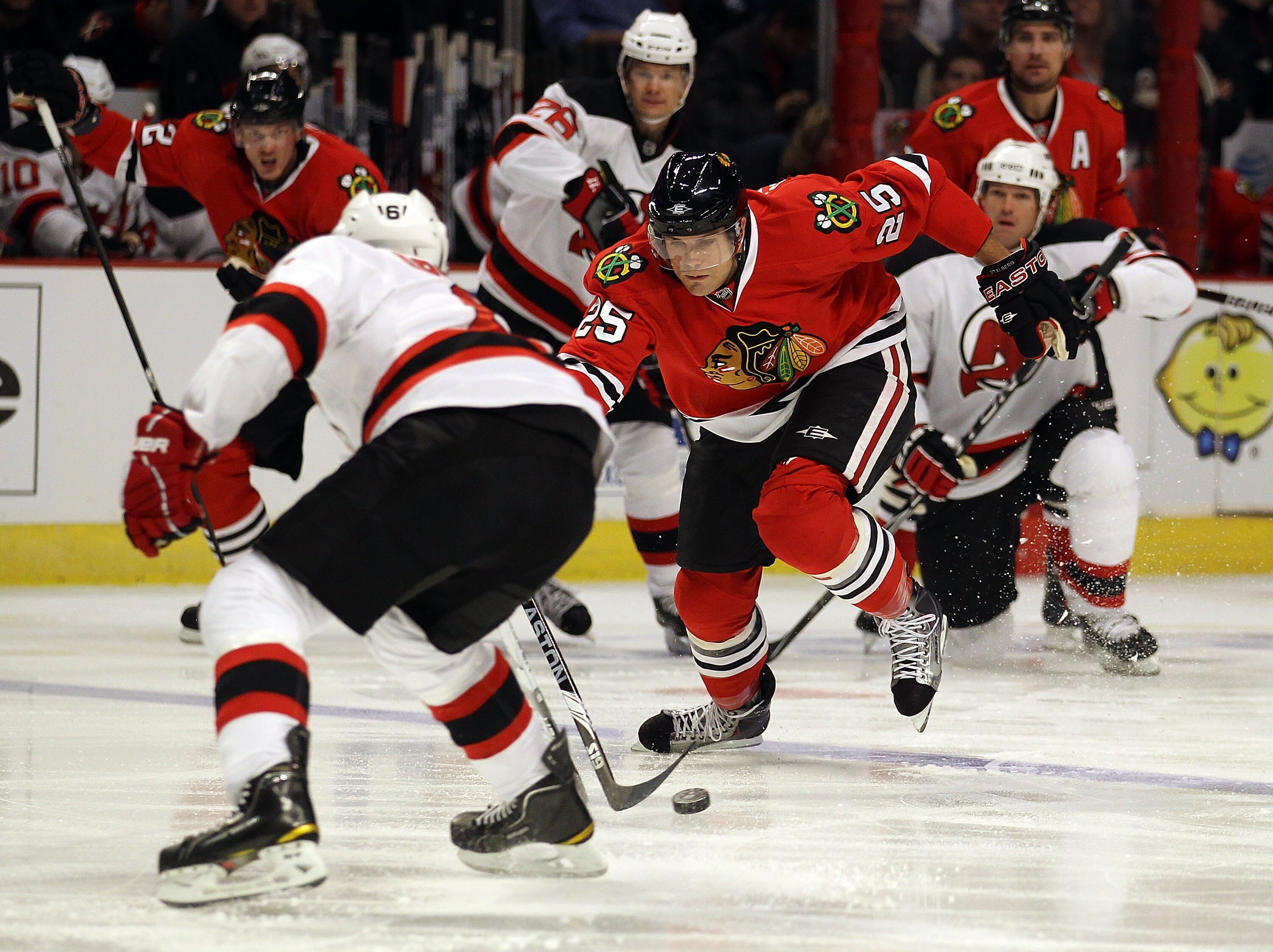 CHICAGO - NOVEMBER 03: Viktor Stalberg #25 of the Chicago Blackhawks challenges Andy Greene #6 of the New Jersey Devils at the United Center on November 3, 2010 in Chicago, Illinois. The Devils defeated the Blackhawks 5-3. (Photo by Jonathan Daniel/Getty