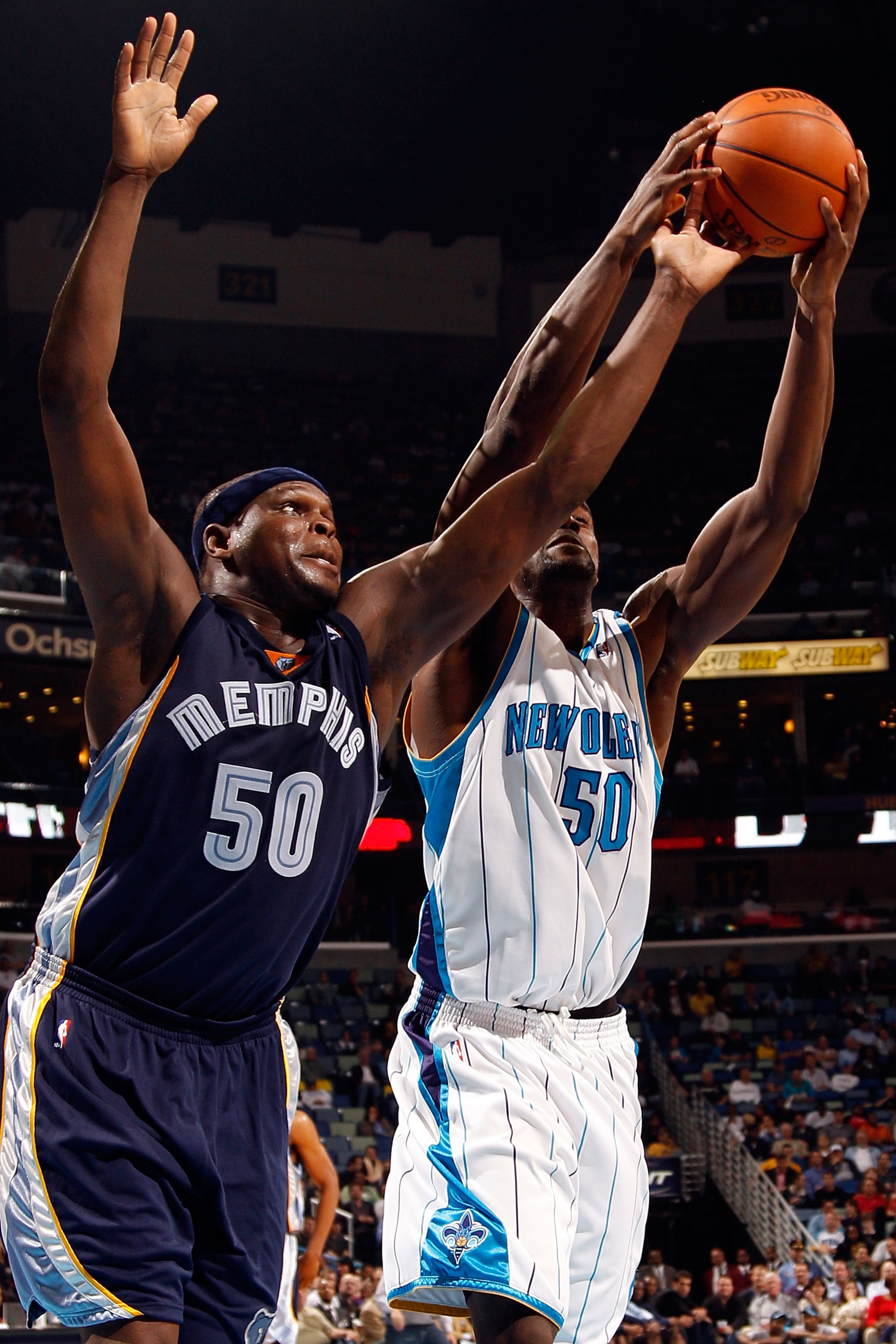 NEW ORLEANS - JANUARY 20:  Zach Randolph #50 of the Memphis Grizzlies battles for a rebound with Emeka Okafor #50 of the New Orleans Hornets at the New Orleans Arena on January 20, 2010 in New Orleans, Louisiana.  The Hornets defeated the Grizzlies 113-11