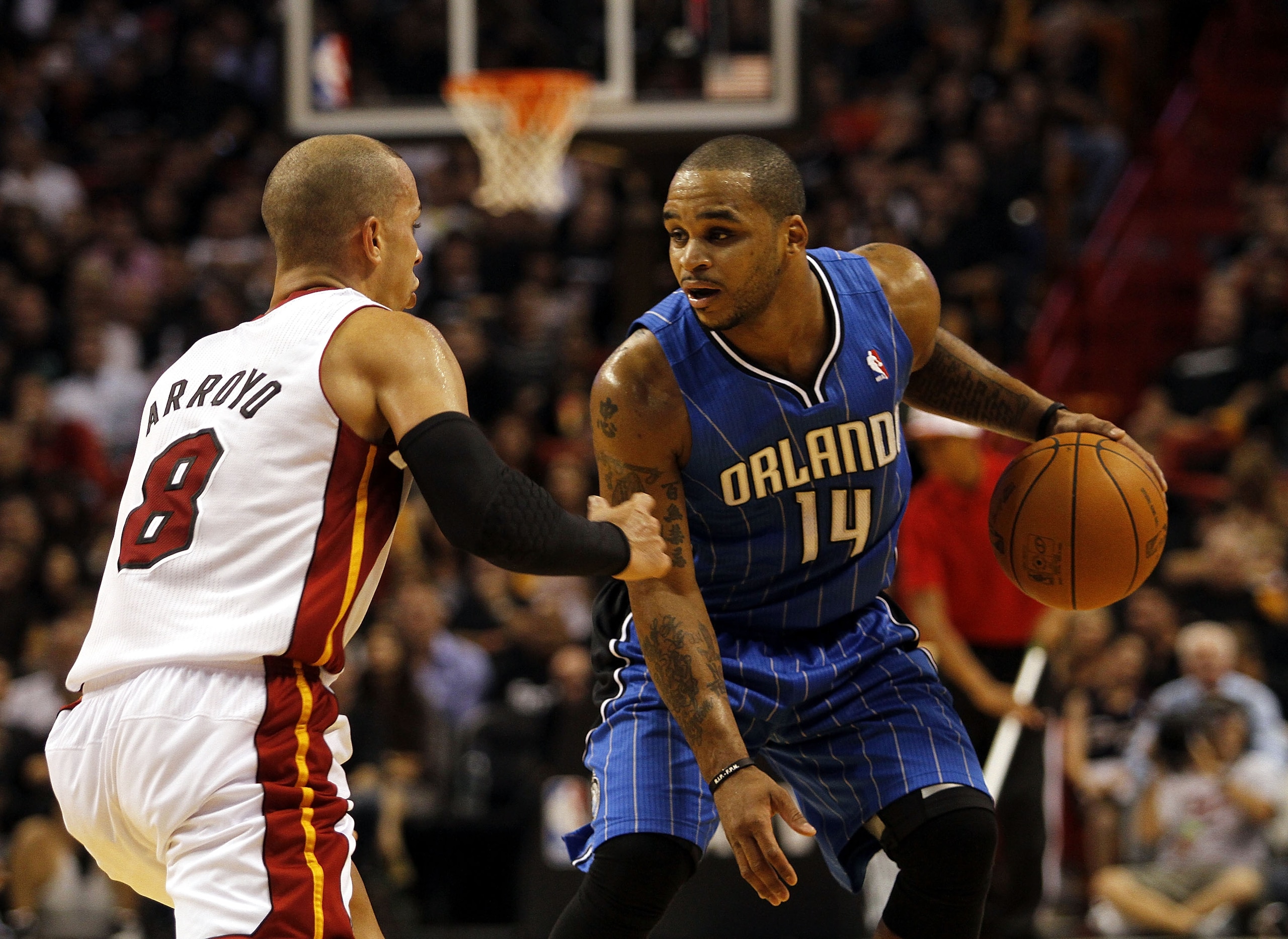 MIAMI - OCTOBER 29: Guard Jameer Nelson #14 of the Orlando Magic brings up the ball against guard Carlos Arroyo #8 of the Miami Heat at American Airlines Arena on October 29, 2010 in Miami, Florida. NOTE TO USER: User expressly acknowledges and agrees t MIAMI - OCTOBER 29: Guard Jameer Nelson #14 of the Orlando Magic brings up the ball against guard Carlos Arroyo #8 of the Miami Heat at American Airlines Arena on October 29, 2010 in Miami, Florida. NOTE TO USER: User expressly acknowledges and agrees t