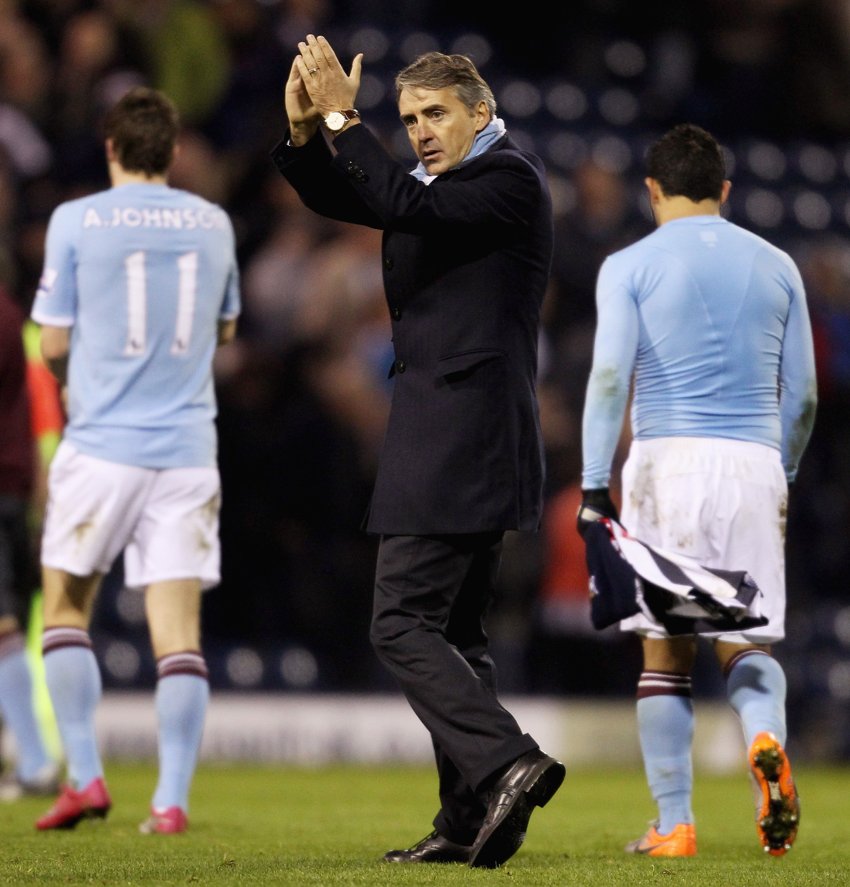 WEST BROMWICH, ENGLAND - NOVEMBER 07: Manchester City manager Roberto Mancini applauds the travelling fans after the Barclays Premier League match between West Bromwich Albion and Manchester City at The Hawthorns on November 7, 2010 in West Bromwich, Engl
