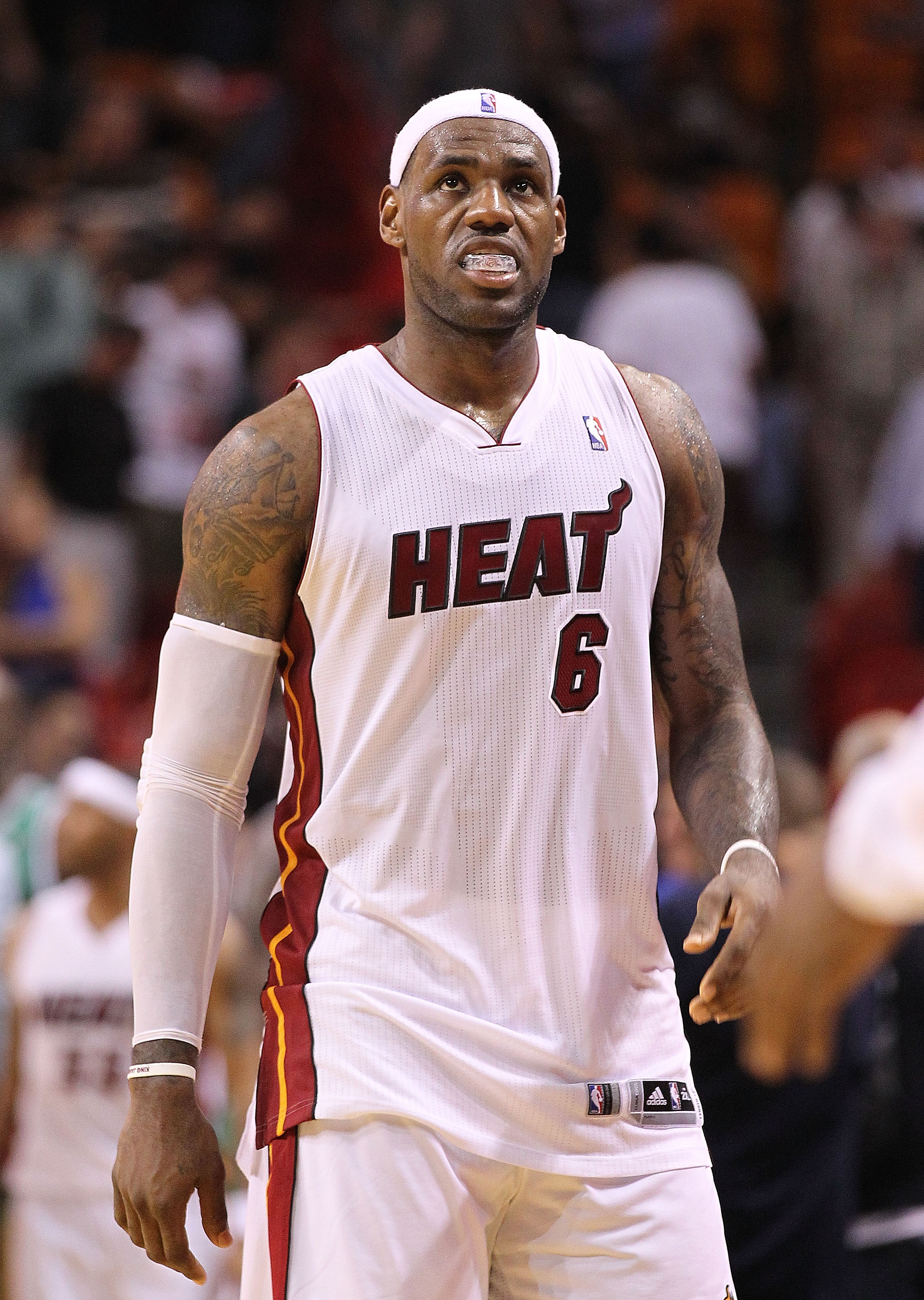 MIAMI - NOVEMBER 11:  LeBron James #6 of the Miami Heat walks off the court after losing a game against the Boston Celtics at American Airlines Arena on November 11, 2010 in Miami, Florida. NOTE TO USER: User expressly acknowledges and agrees that, by dow