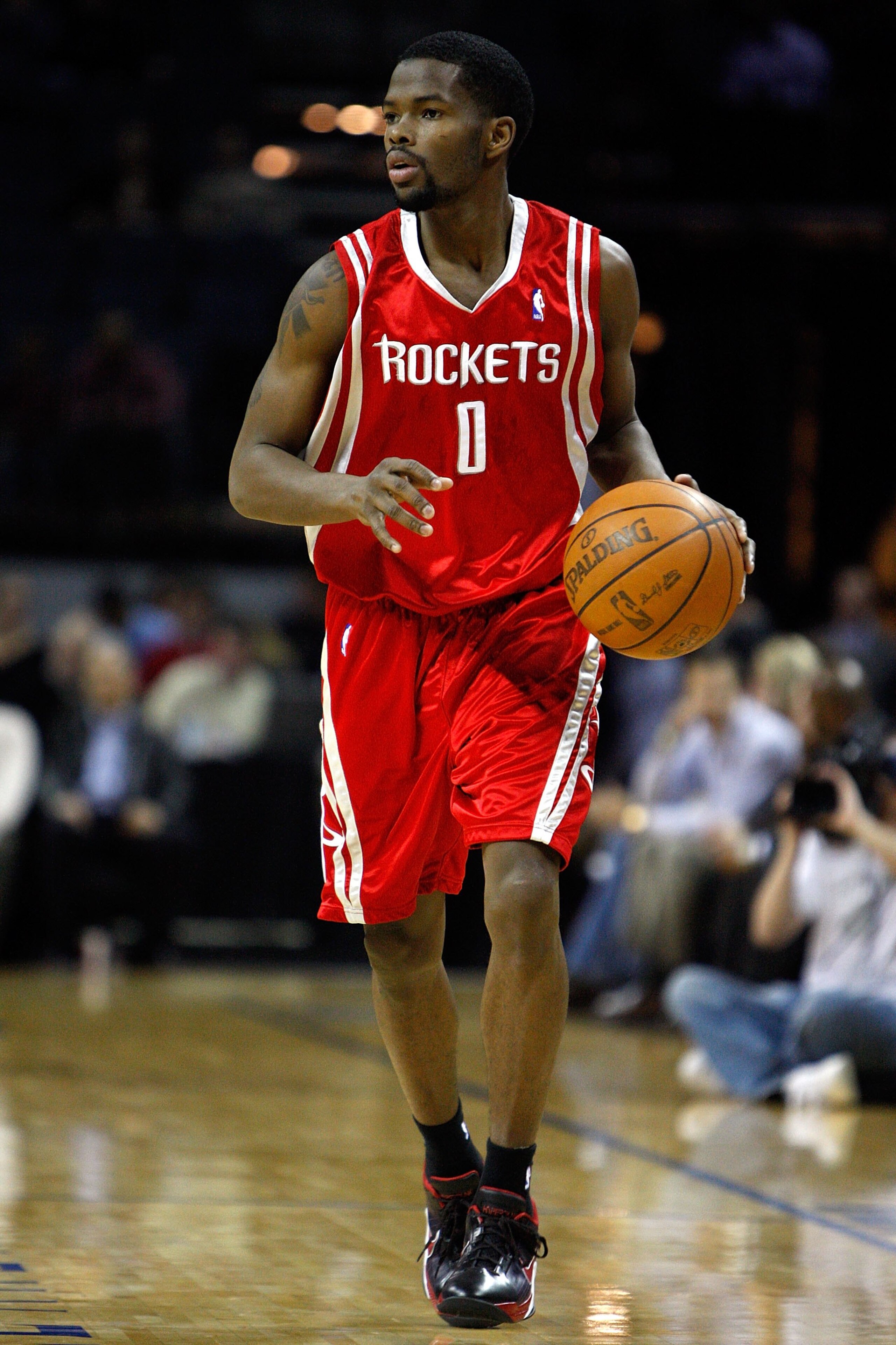 CHARLOTTE, NC - JANUARY 12:  Aaron Brooks #0 of the Houston Rockets brings the ball up court during the game against the Charlotte Bobcats on January 12, 2010 at Time Warner Cable Arena in Charlotte, North Carolina.  The Bobcats won 102-94.  NOTE TO USER: