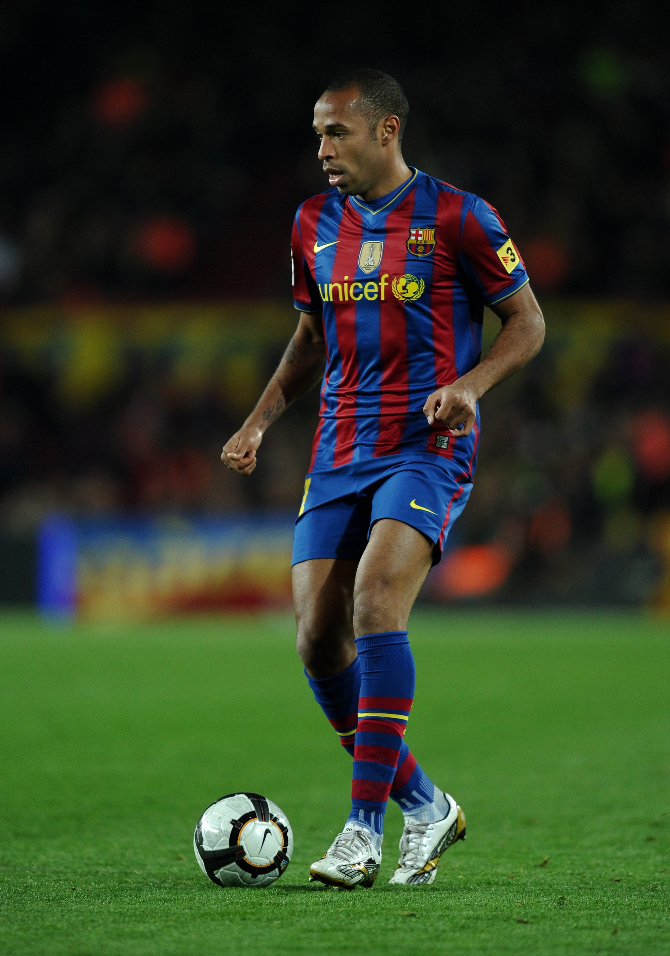 BARCELONA, SPAIN - APRIL 14:  Thierry Henry of FC Barcelona walks with the ball during the La Liga match between Barcelona and Deportivo La Coruna at the Camp Nou stadium on April 14, 2010 in Barcelona, Spain. Barcelona won the match 3-0.  (Photo by Jaspe