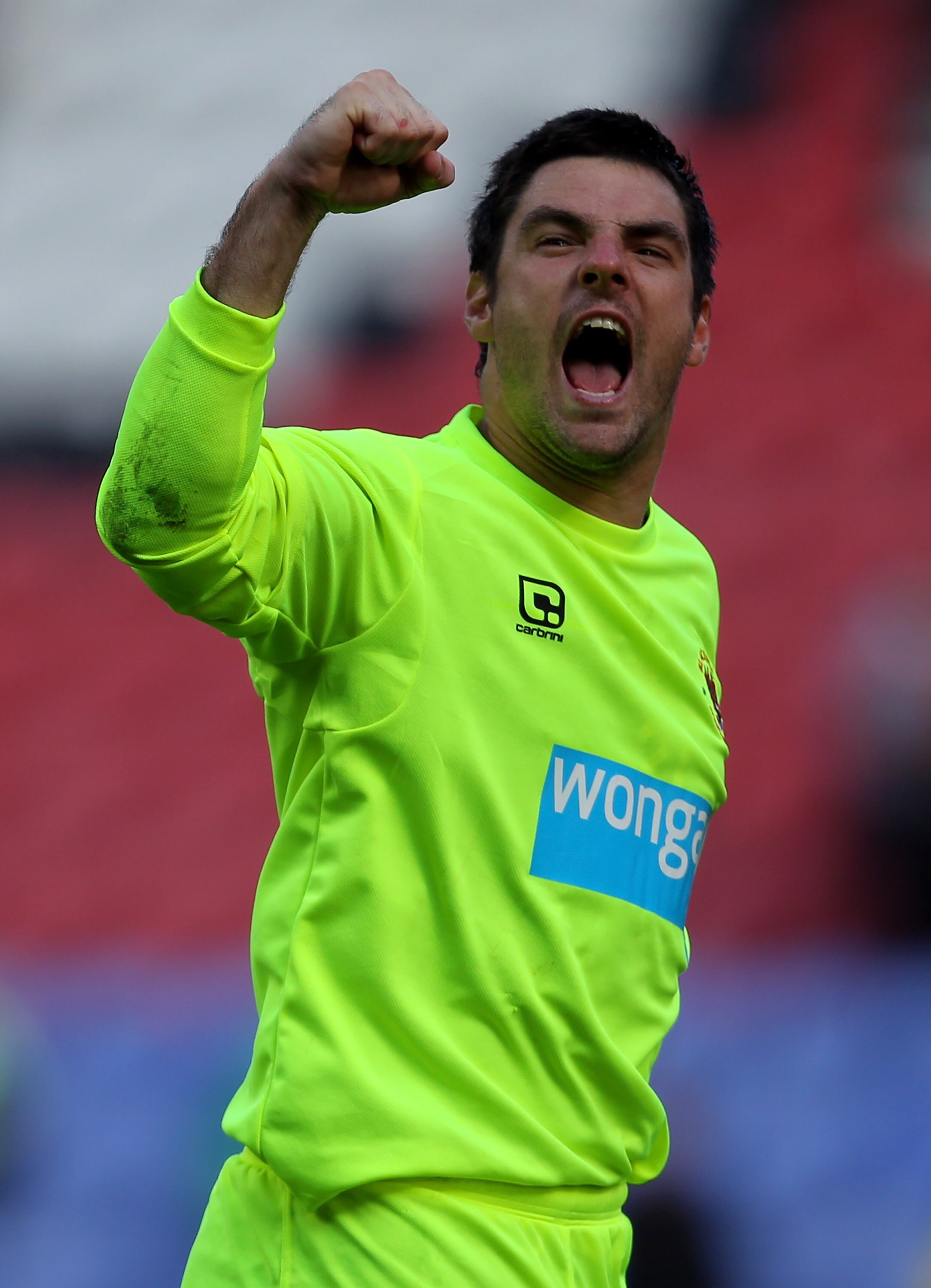 WIGAN, ENGLAND - AUGUST 14:  Matthew Gilks of Blackpool celebrates victory at the end of the Barclays Premier League match between Wigan Athletic and Blackpool at the DW Stadium on August 14, 2010 in Wigan, England.  (Photo by Alex Livesey/Getty Images)