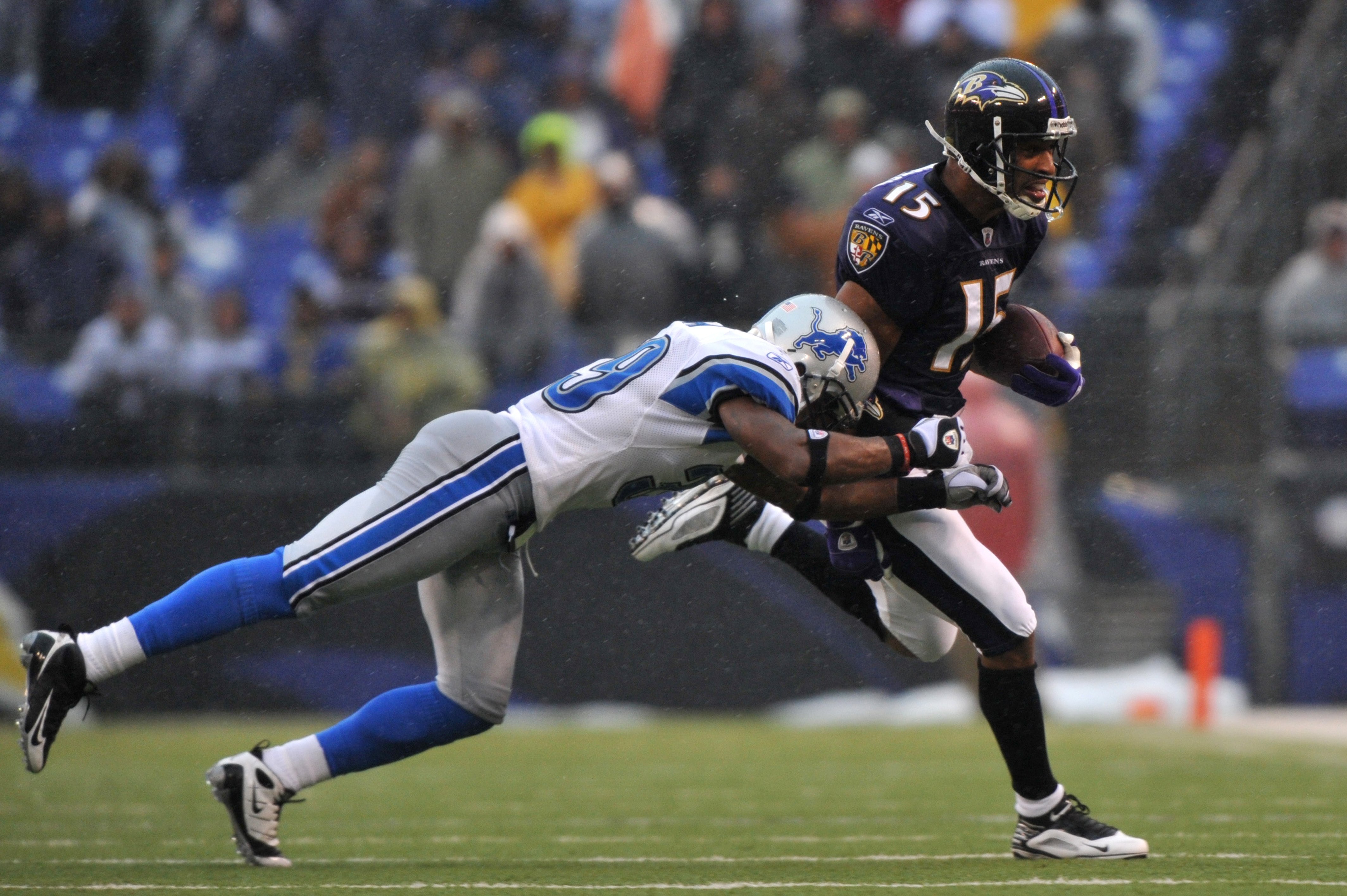 BALTIMORE - DECEMBER 13:  Kelley Washington #15 of the Baltimore Ravens runs the ball during the game against the Detroit Lions at M&T Bank Stadium on December 13, 2009 in Baltimore, Maryland. The Ravens defeated the Lions 48-3. (Photo by Larry French/Get