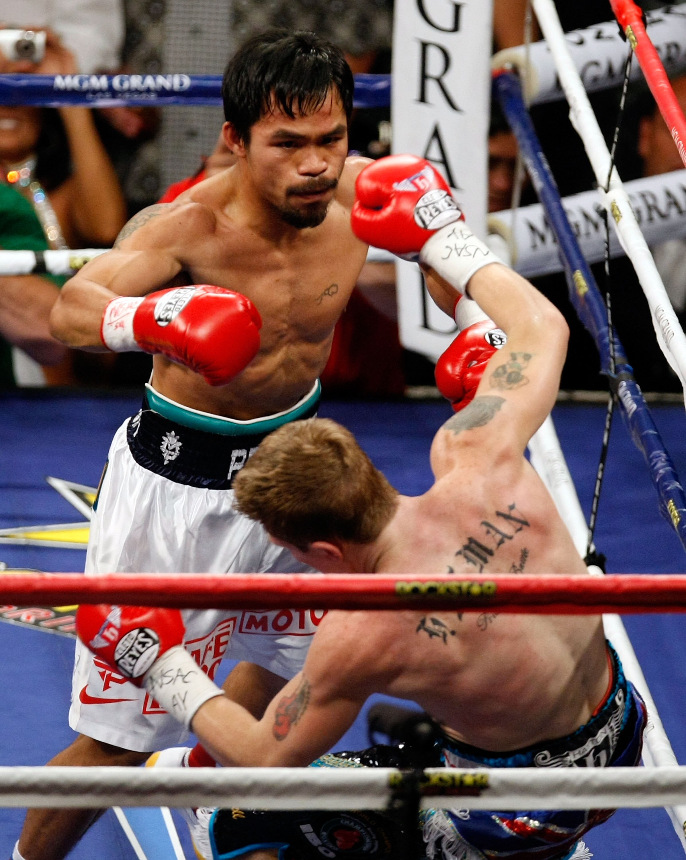 LAS VEGAS - MAY 02:  (L-R) Manny Pacquiao of the Philippines knocks down Ricky Hatton of England during their junior welterweight title fight at the MGM Grand Garden Arena May 2, 2009 in Las Vegas, Nevada.  (Photo by Ethan Miller/Getty Images)