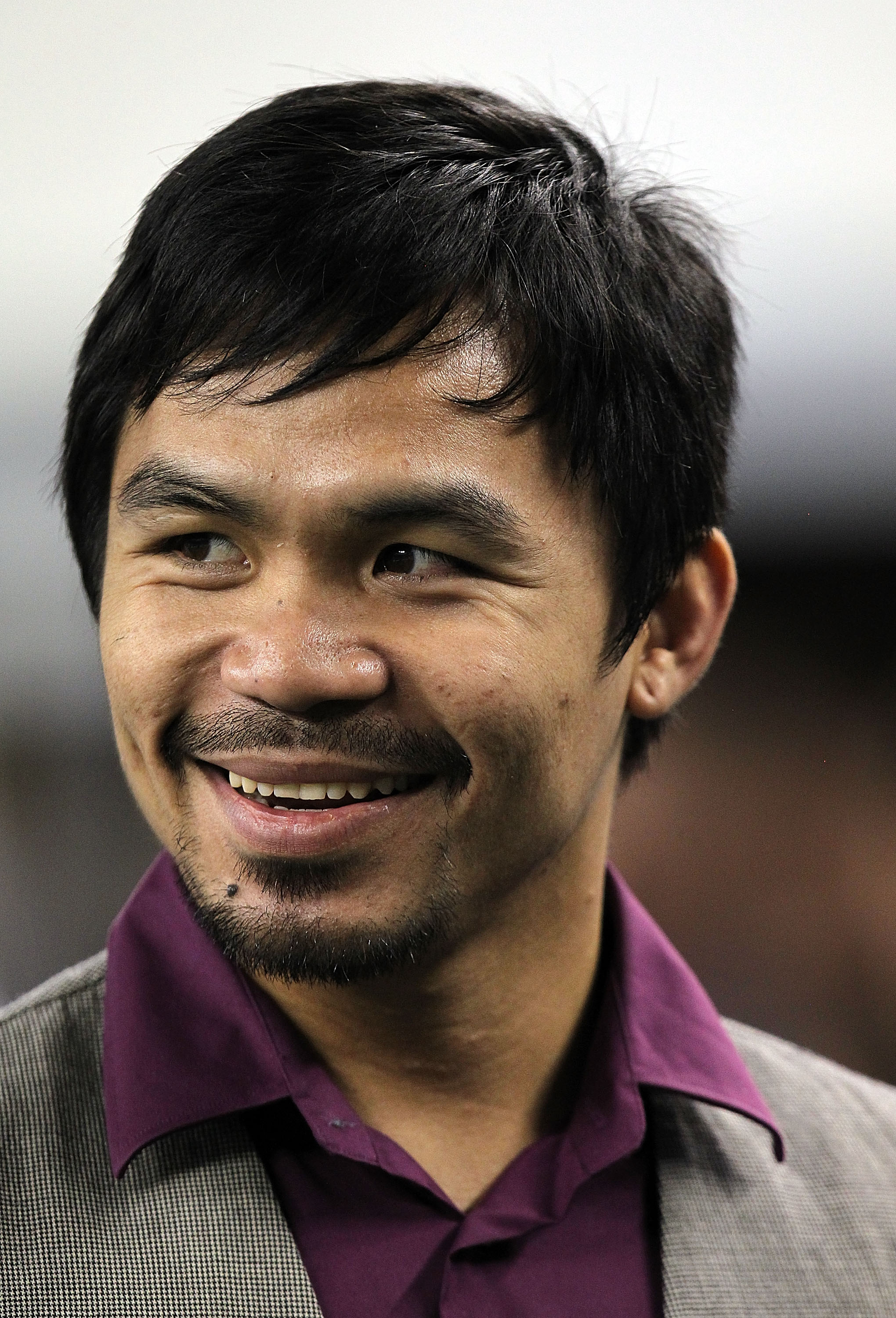 ARLINGTON, TX - SEPTEMBER 02:  Professional boxer Manny Pacquiao watches a preseason game between the Miami Dolphins and the Dallas Cowboys at Cowboys Stadium on September 2, 2010 in Arlington, Texas.  (Photo by Ronald Martinez/Getty Images)