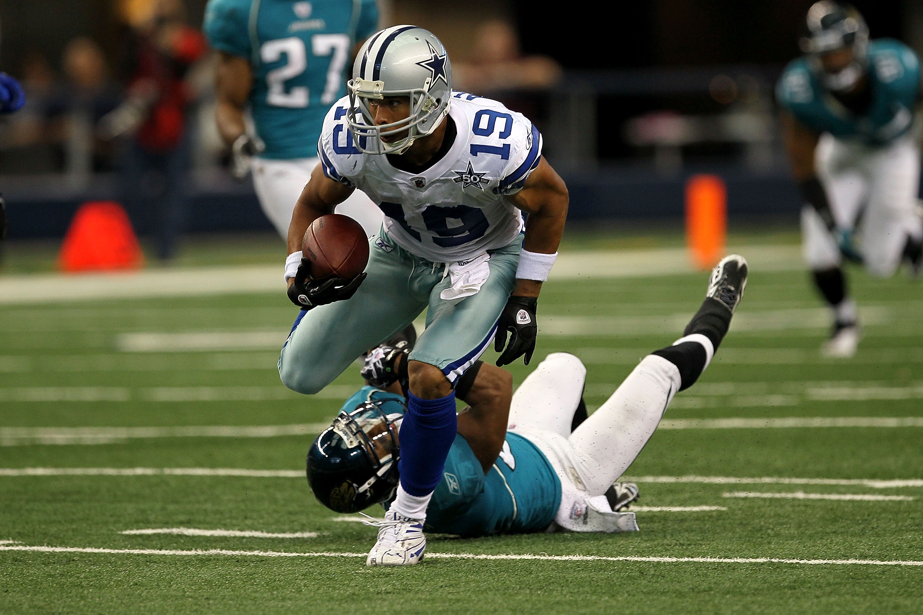 ARLINGTON, TX - OCTOBER 31:  Miles Austin #19 of the Dallas Cowboys runs for yards after the catch against the Jacksonville Jaguars at Cowboys Stadium on October 31, 2010 in Arlington, Texas.  (Photo by Stephen Dunn/Getty Images)