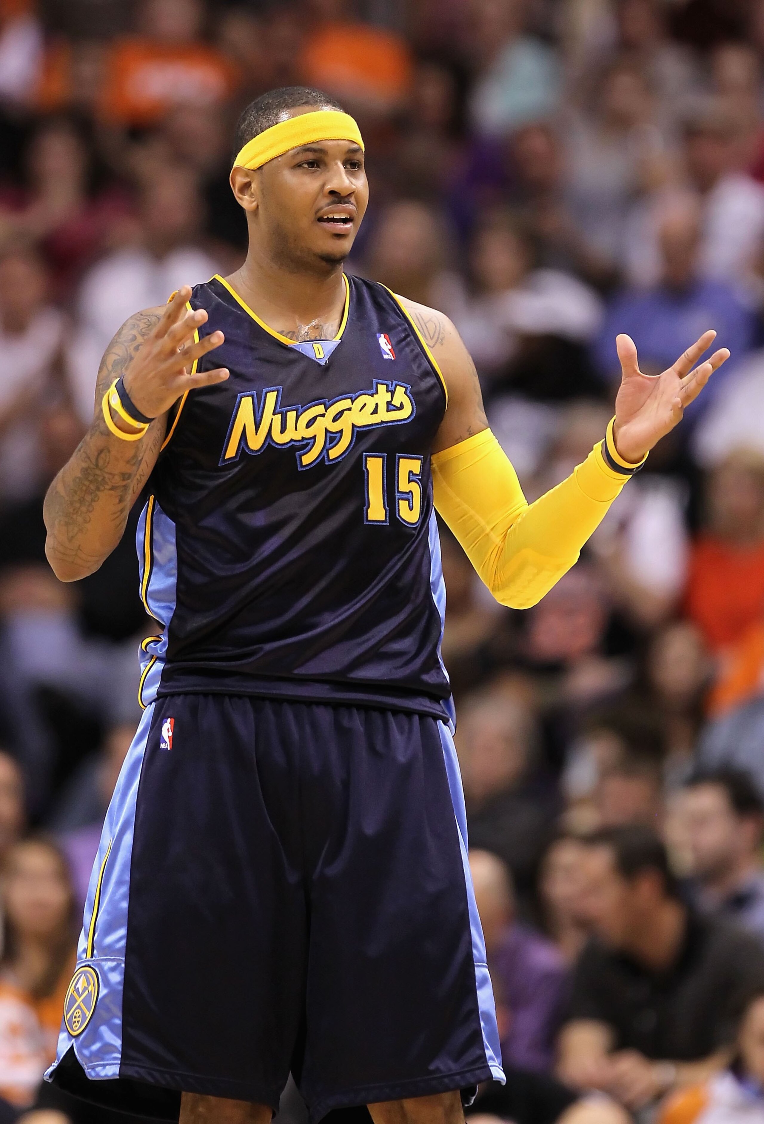 PHOENIX - APRIL 13: Carmelo Anthony #15 of the Denver Nuggets reacts during the NBA game against the Phoenix Suns at US Airways Center on April 13, 2010 in Phoenix, Arizona. The Suns defeated the Nuggets 123-101. NOTE TO USER: User expressly acknowledge PHOENIX - APRIL 13: Carmelo Anthony #15 of the Denver Nuggets reacts during the NBA game against the Phoenix Suns at US Airways Center on April 13, 2010 in Phoenix, Arizona. The Suns defeated the Nuggets 123-101. NOTE TO USER: User expressly acknowledge