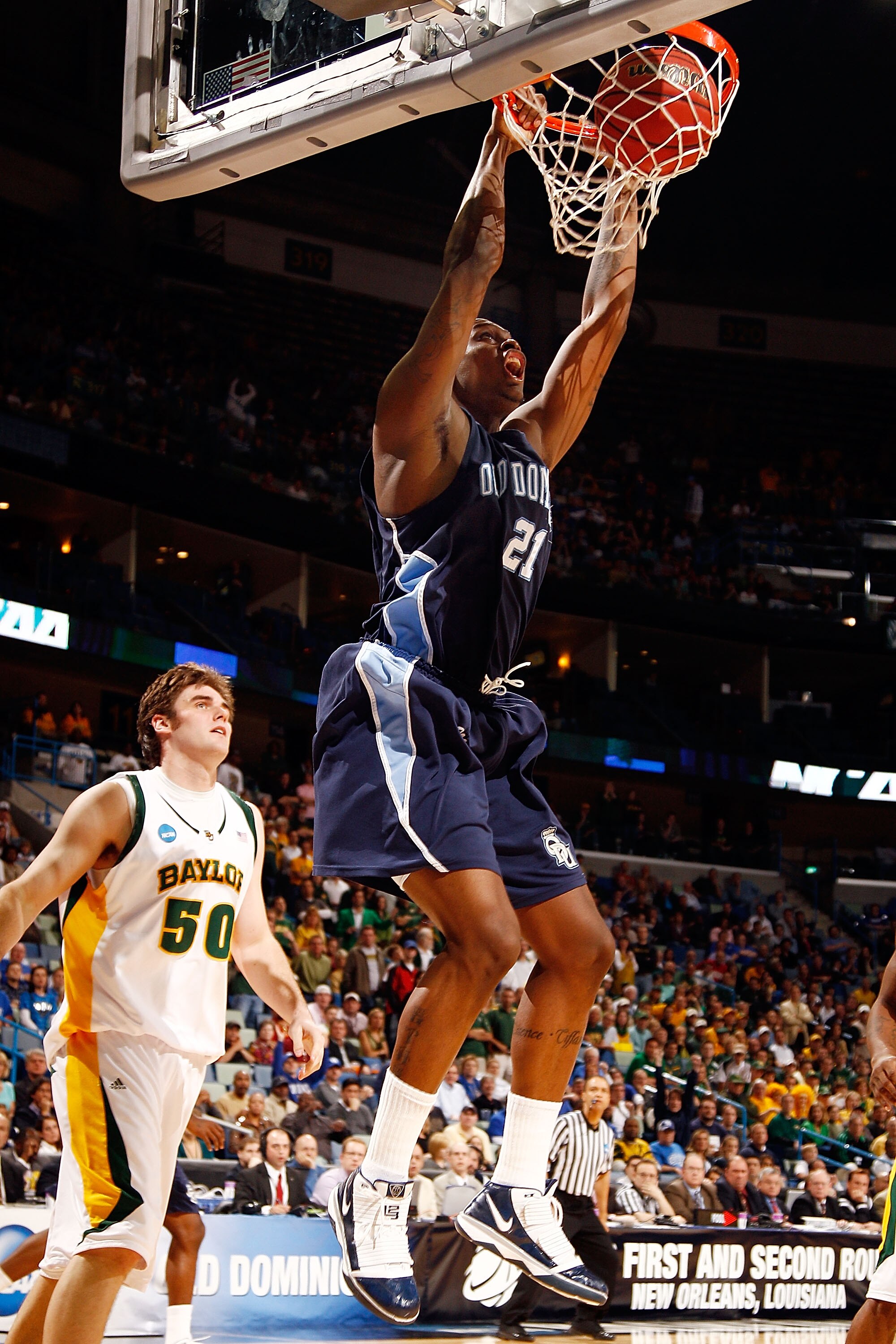NEW ORLEANS - MARCH 20: Frank Hassell #21 of the Old Dominion University Monarchs dunks the ball over Josh Lomers #50 of the Baylor Bears during the second round of the 2010 NCAA men's basketball tournament at the New Orleans Arena on March 20, 2010 in N NEW ORLEANS - MARCH 20: Frank Hassell #21 of the Old Dominion University Monarchs dunks the ball over Josh Lomers #50 of the Baylor Bears during the second round of the 2010 NCAA men's basketball tournament at the New Orleans Arena on March 20, 2010 in N