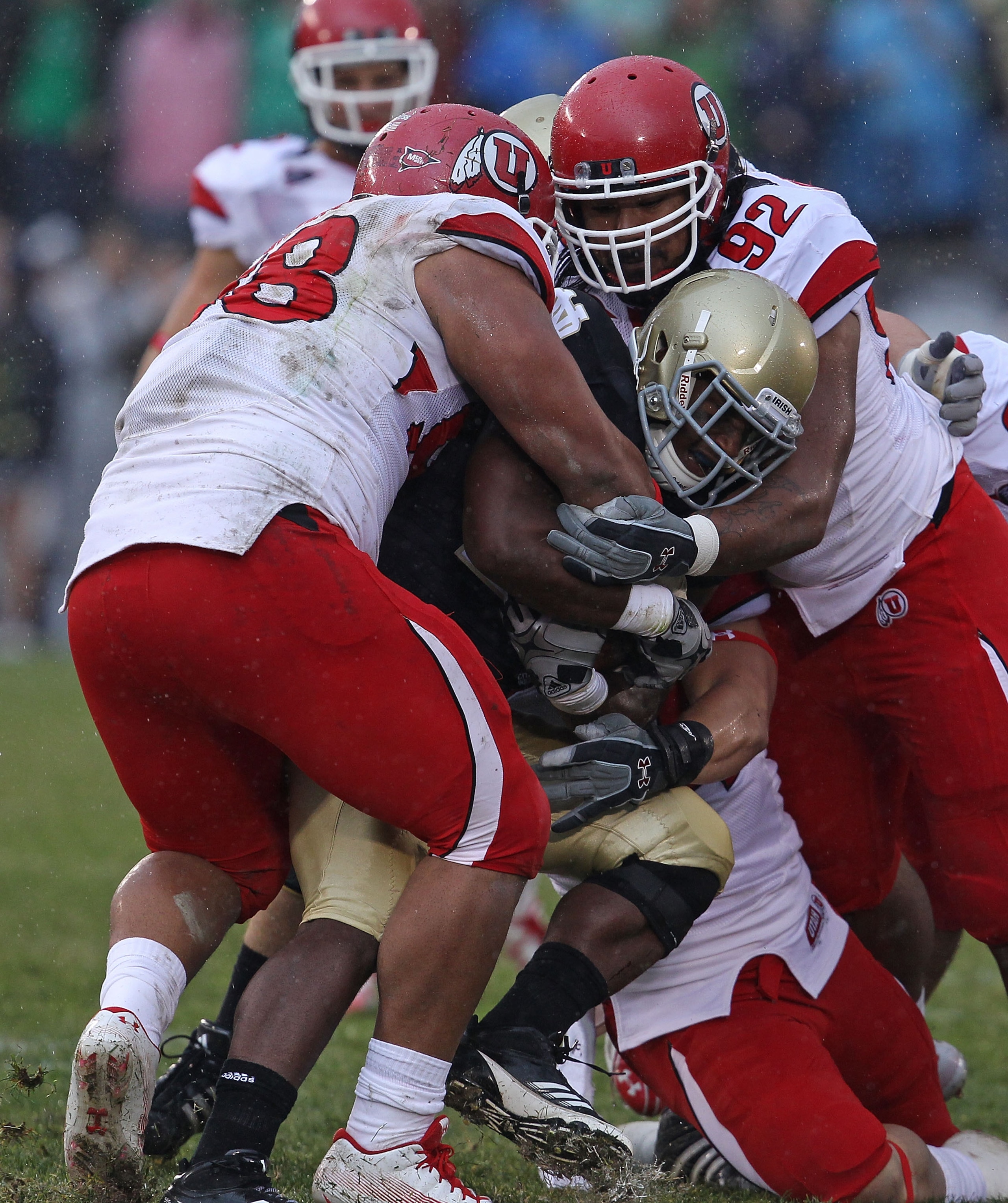 SOUTH BEND, IN - NOVEMBER 13: Sealver Siliga #98 and Star Lotulelei #92 of the Utah Utes stop Jonas Gray #25 of the Notre Dame Fighting Irish at Notre Dame Stadium on November 13, 2010 in South Bend, Indiana. (Photo by Jonathan Daniel/Getty Images)
