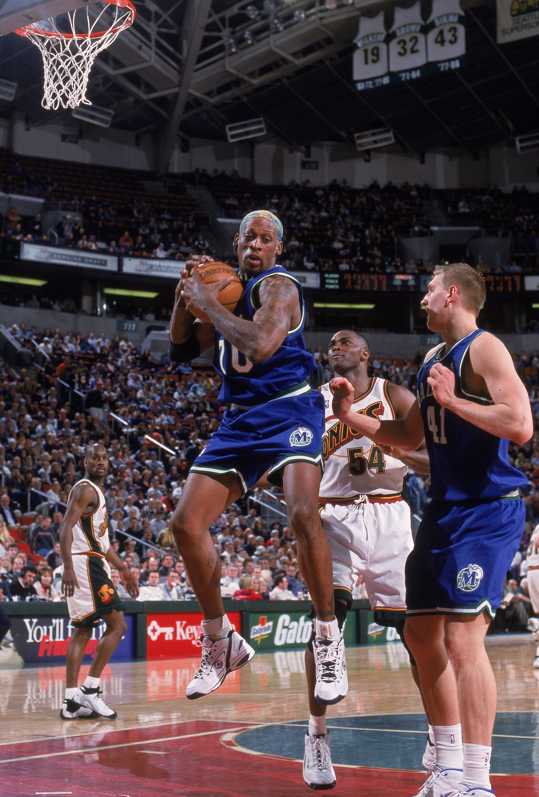 7 Mar 2000: Dennis Rodman #70 of the Dallas Mavericks rebounds the ball during a game against the Seattle SuperSonics at the Key Arena in Seattle, Washington. The Sonics defeated the Mavericks 101-86.