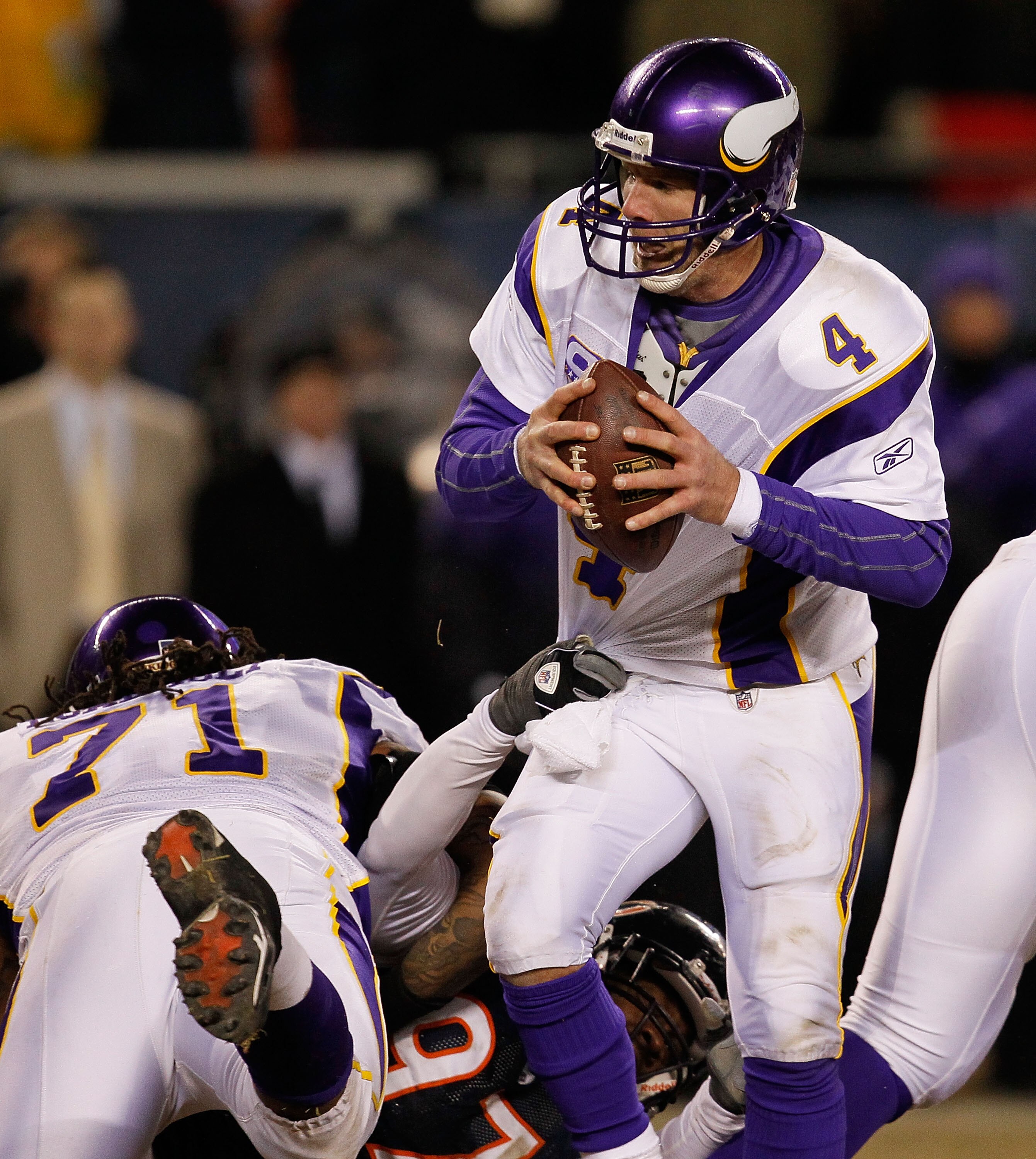 CHICAGO - DECEMBER 28: Brett Favre #4 of the Minnesota Vikings is sacked by Mark Anderson #97 of the Chicago Bears as Phil Loadholt #71 holds Anderson to the ground at Soldier Field on December 28, 2009 in Chicago, Illinois. The Bears defeated the Vikings