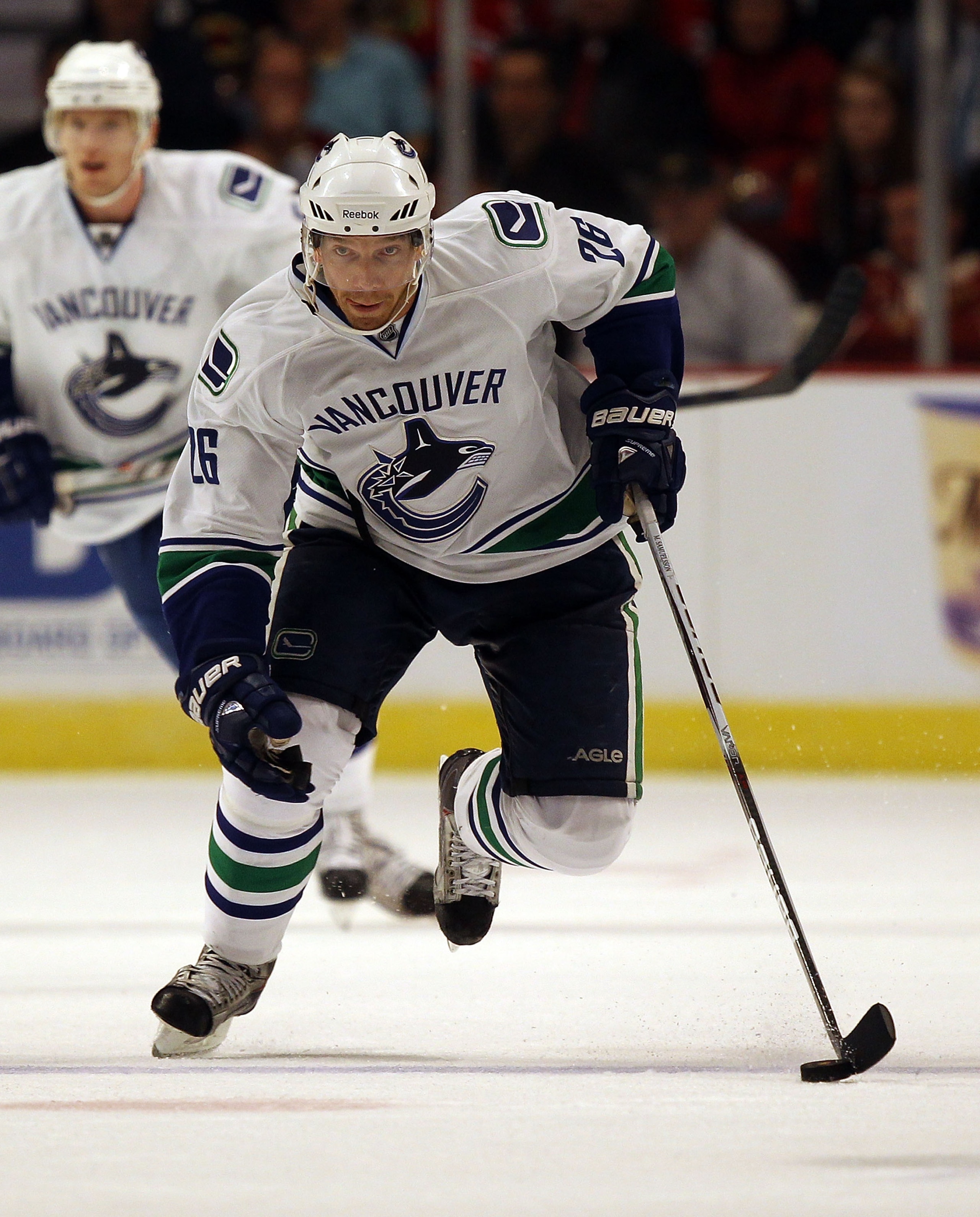 CHICAGO - OCTOBER 20: Mikael Samuelsson #26 of the Vancouver Canucks skates up the ice against the Chicago Blackhawks at the United Center on October 20, 2010 in Chicago, Illinois. The Blackhawks defeated the Canucks 2-1 in overtime. (Photo by Jonathan Da