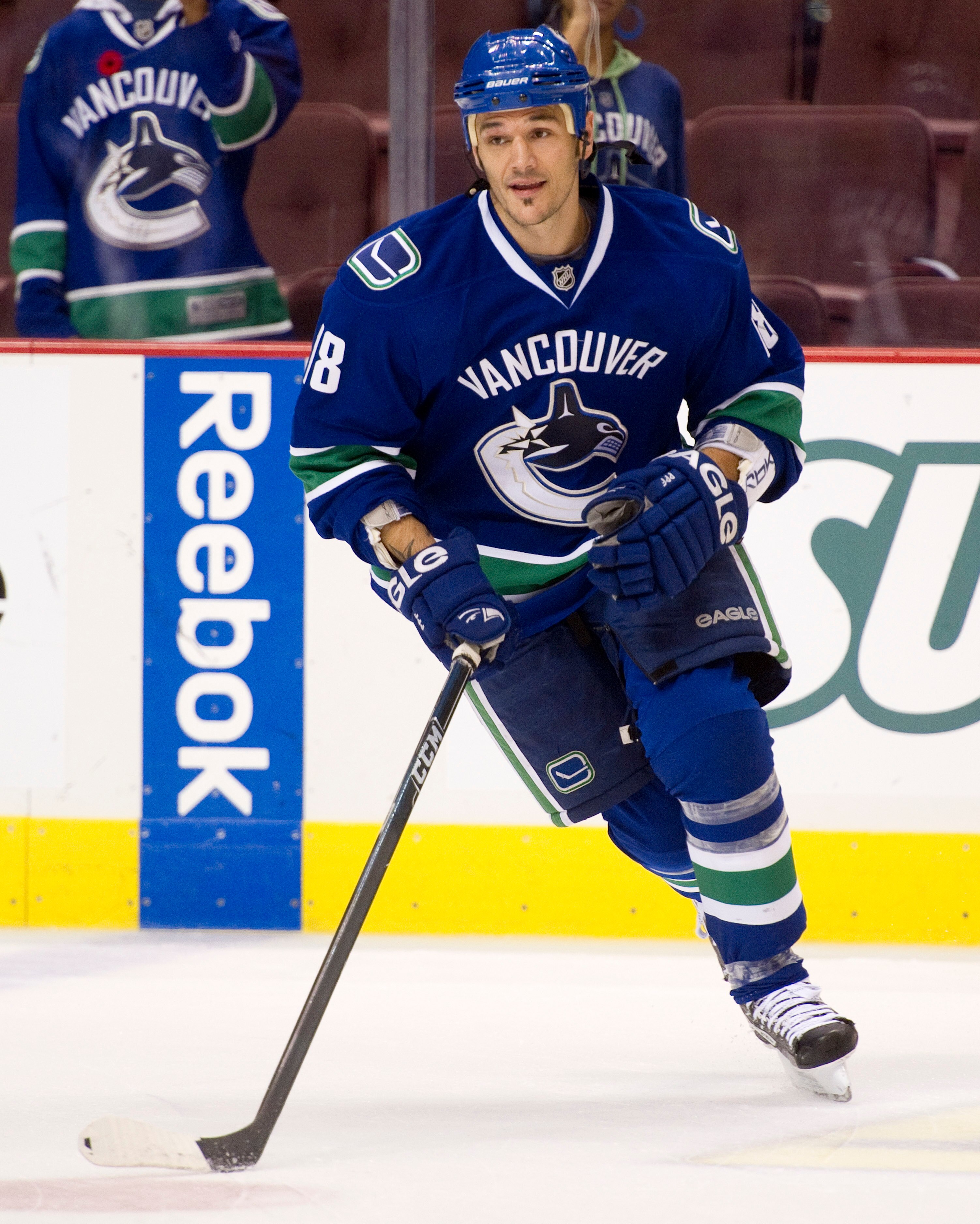 VANCOUVER, CANADA - NOVEMBER 1: Peter Schaefer #18 of the Vancouver Canucks takes part in the pre-game sakte prior to NHL action against the New Jersey Devils on November 01, 2010 at Rogers Arena in Vancouver, British Columbia, Canada.  (Photo by Rich Lam