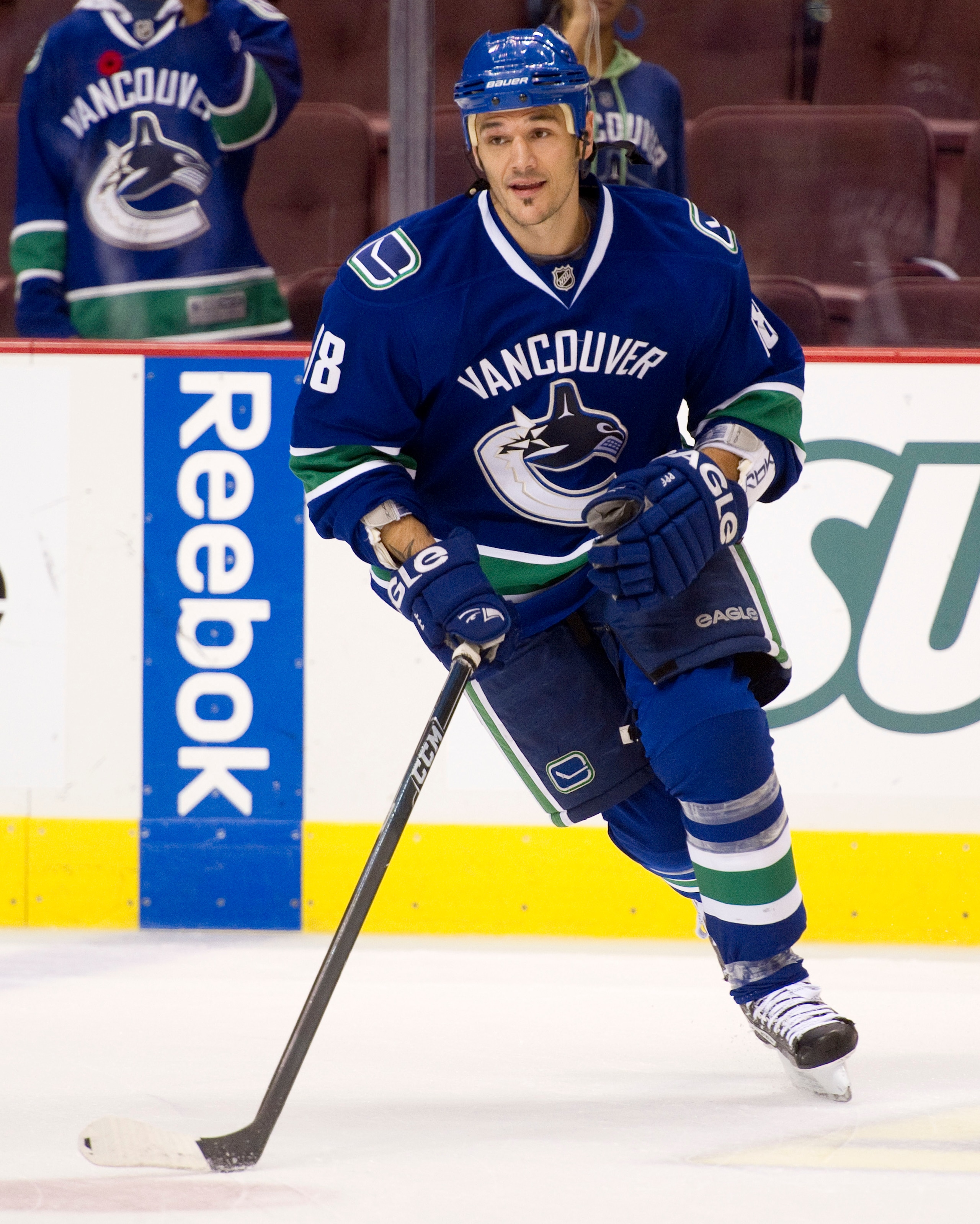 VANCOUVER, CANADA - NOVEMBER 1: Peter Schaefer #18 of the Vancouver Canucks takes part in the pre-game sakte prior to NHL action against the New Jersey Devils on November 01, 2010 at Rogers Arena in Vancouver, British Columbia, Canada.  (Photo by Rich Lam