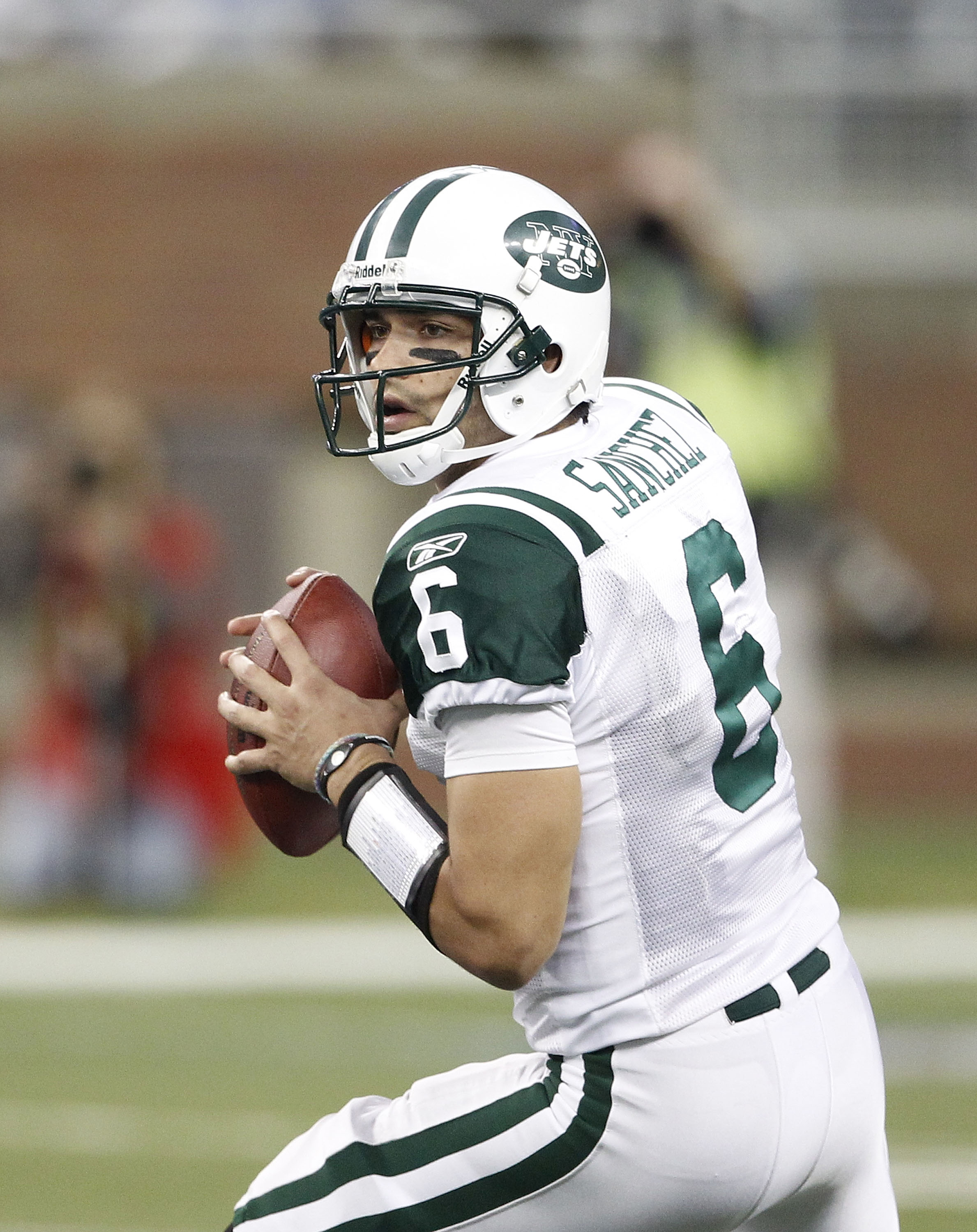 DETROIT - NOVEMBER 07:  Mark Sanchez #6 of the New York Jets looks to throw a pass during the game against the Detroit Lions at Ford Field on November 7, 2010 in Detroit, Michigan. The Jets defeated the Lions 23-20 in overtime.  (Photo by Leon Halip/Getty