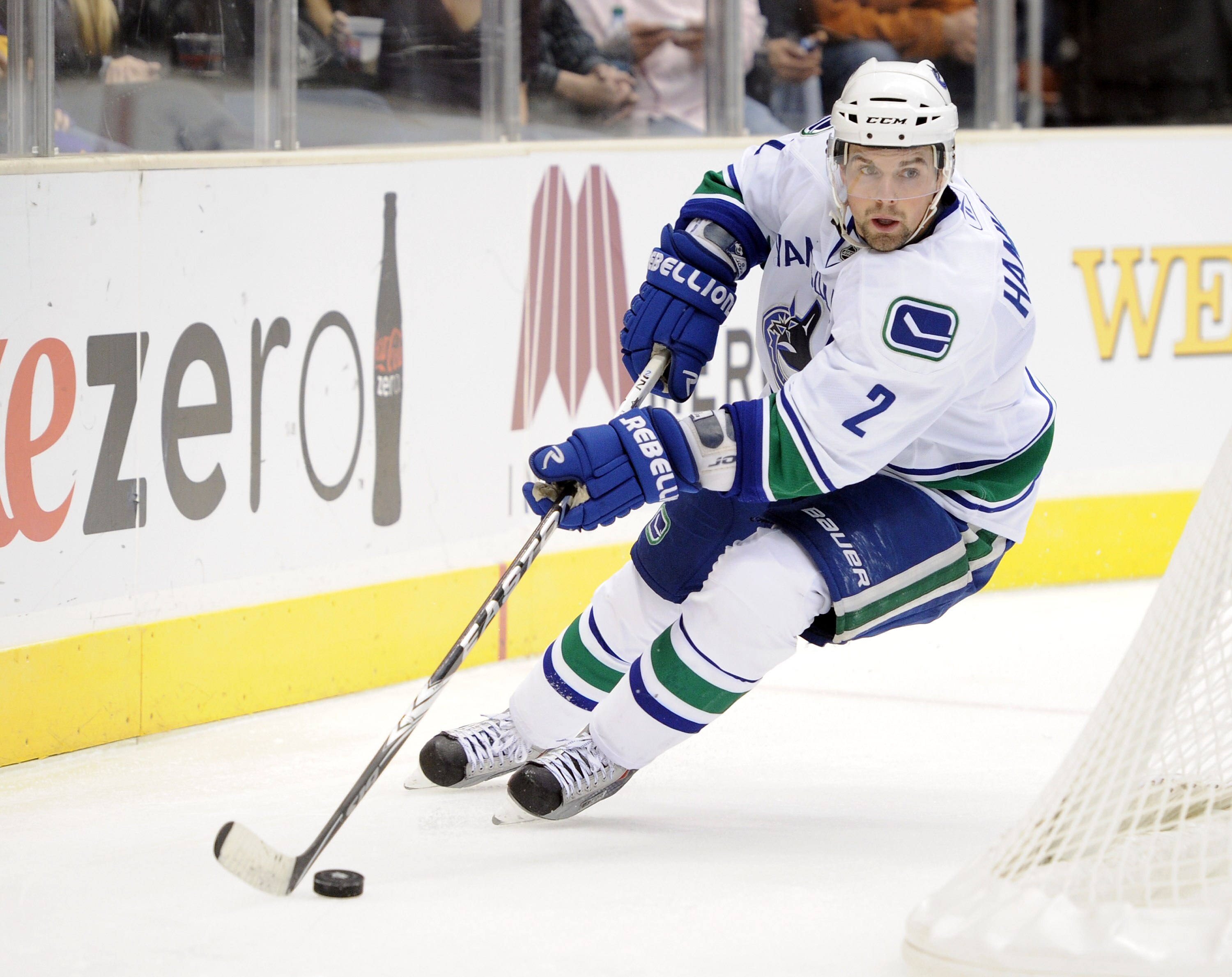 LOS ANGELES, CA - OCTOBER 15:  Dan Hamhuis #2 of the Vancouver Canucks looks to pass the puck against the Los Angeles Kings at the Staples Center on October 15, 2010 in Los Angeles, California.  (Photo by Harry How/Getty Images)