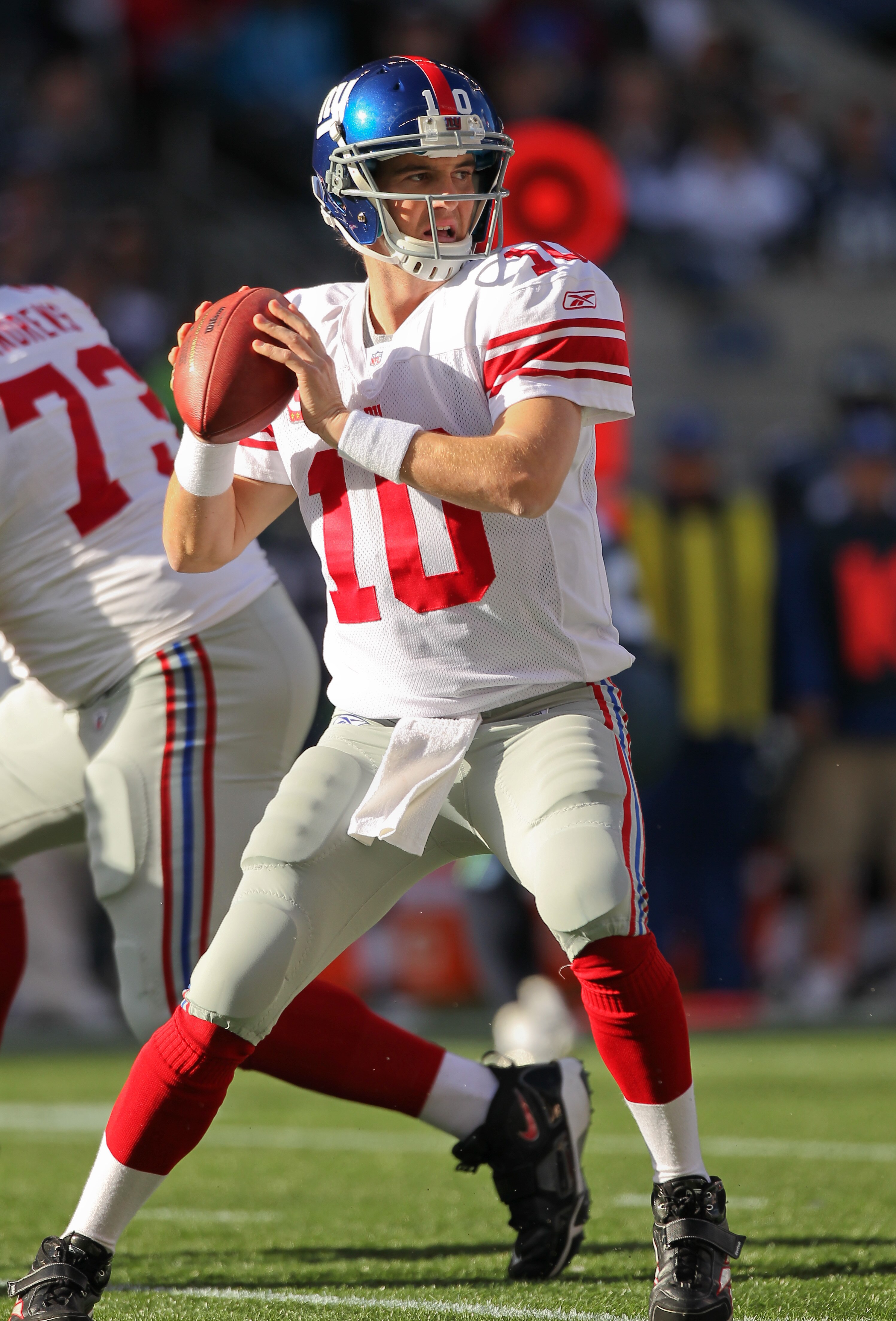 SEATTLE - NOVEMBER 07:  Quarterback Eli Manning #10 of the New York Giants looks downfield against the Seattle Seahawks at Qwest Field on November 7, 2010 in Seattle, Washington. The Giants defeated the Seahawks 41-7. (Photo by Otto Greule Jr/Getty Images