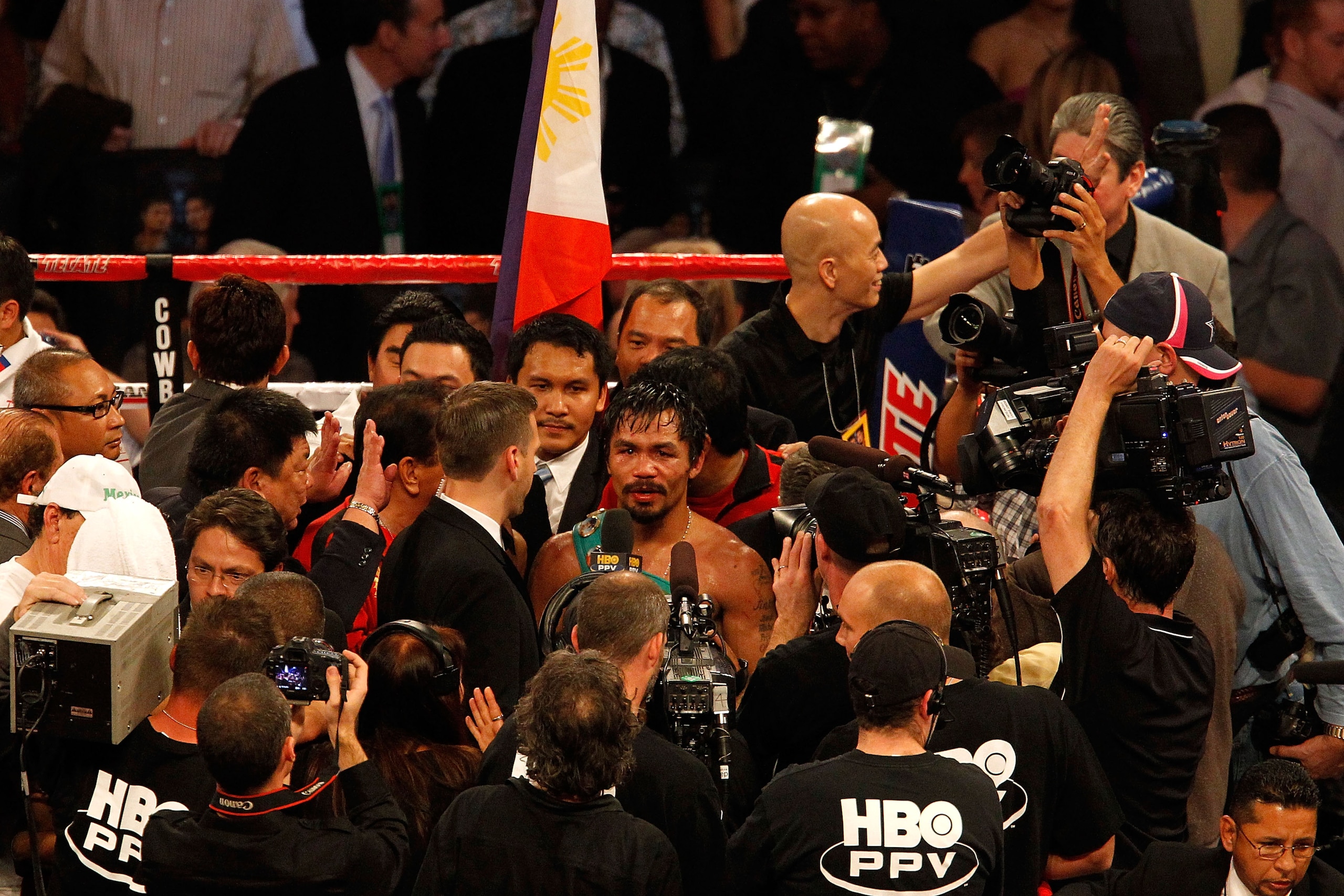 ARLINGTON, TX - NOVEMBER 13:  Manny Pacquiao (white trunks) of the Philippines is interviewed after he won against Antonio Margarito (black trunks) of Mexico during their WBC World Super Welterweight Title bout at Cowboys Stadium on November 13, 2010 in A